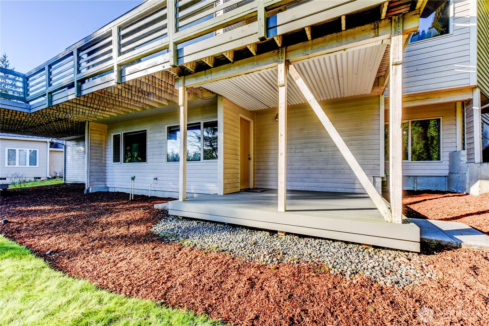 Lower level Bedrooms leads to covered patio and backyard