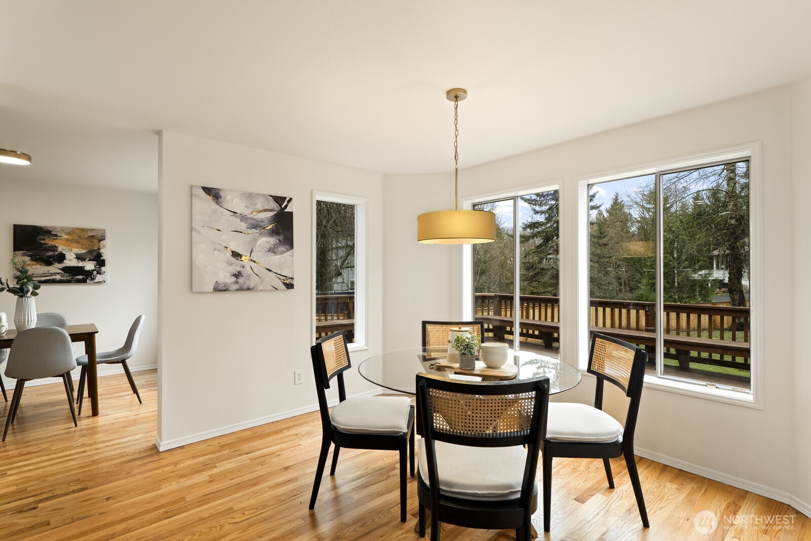 Adjacent informal dining with backyard views.