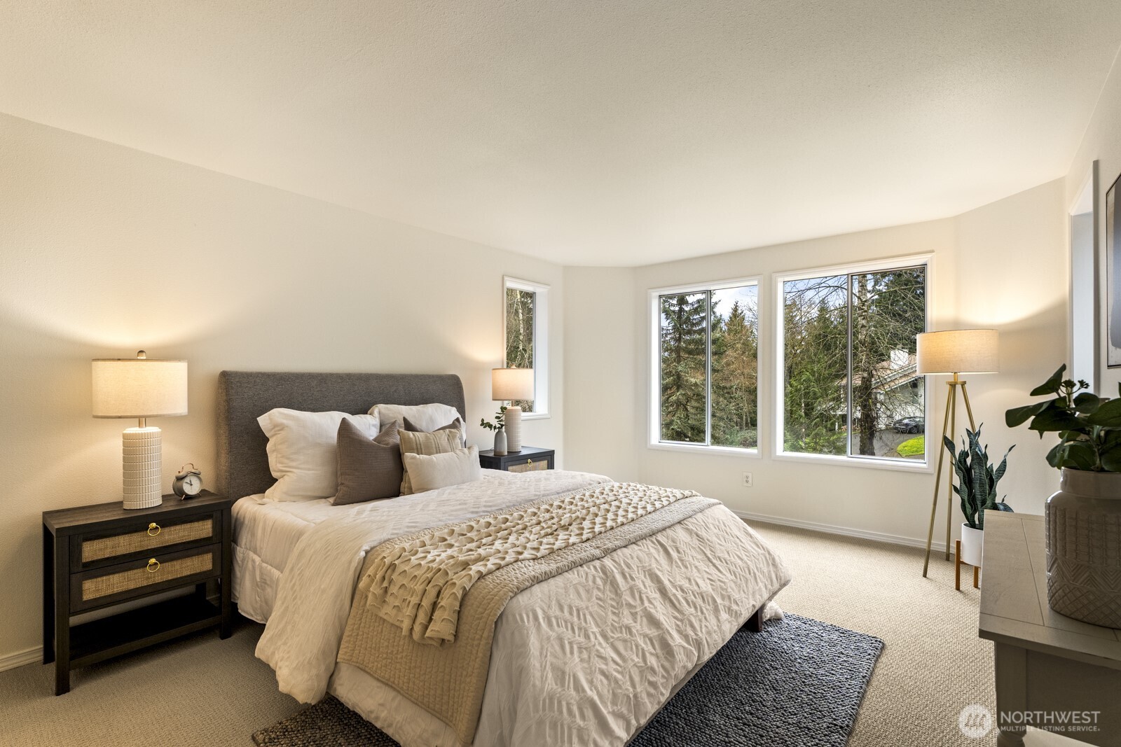 Spacious primary suite overlooking the backyard.