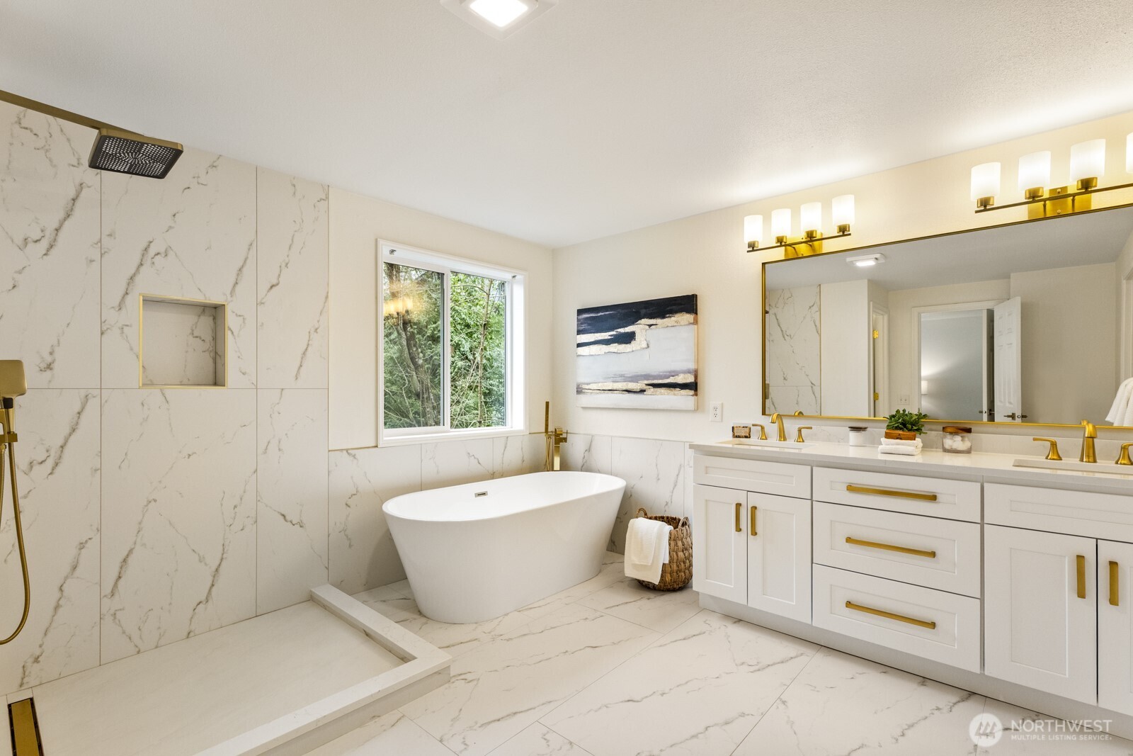 Beautiful primary suite bathroom with soaking tub and tiled shower (glass is now installed).