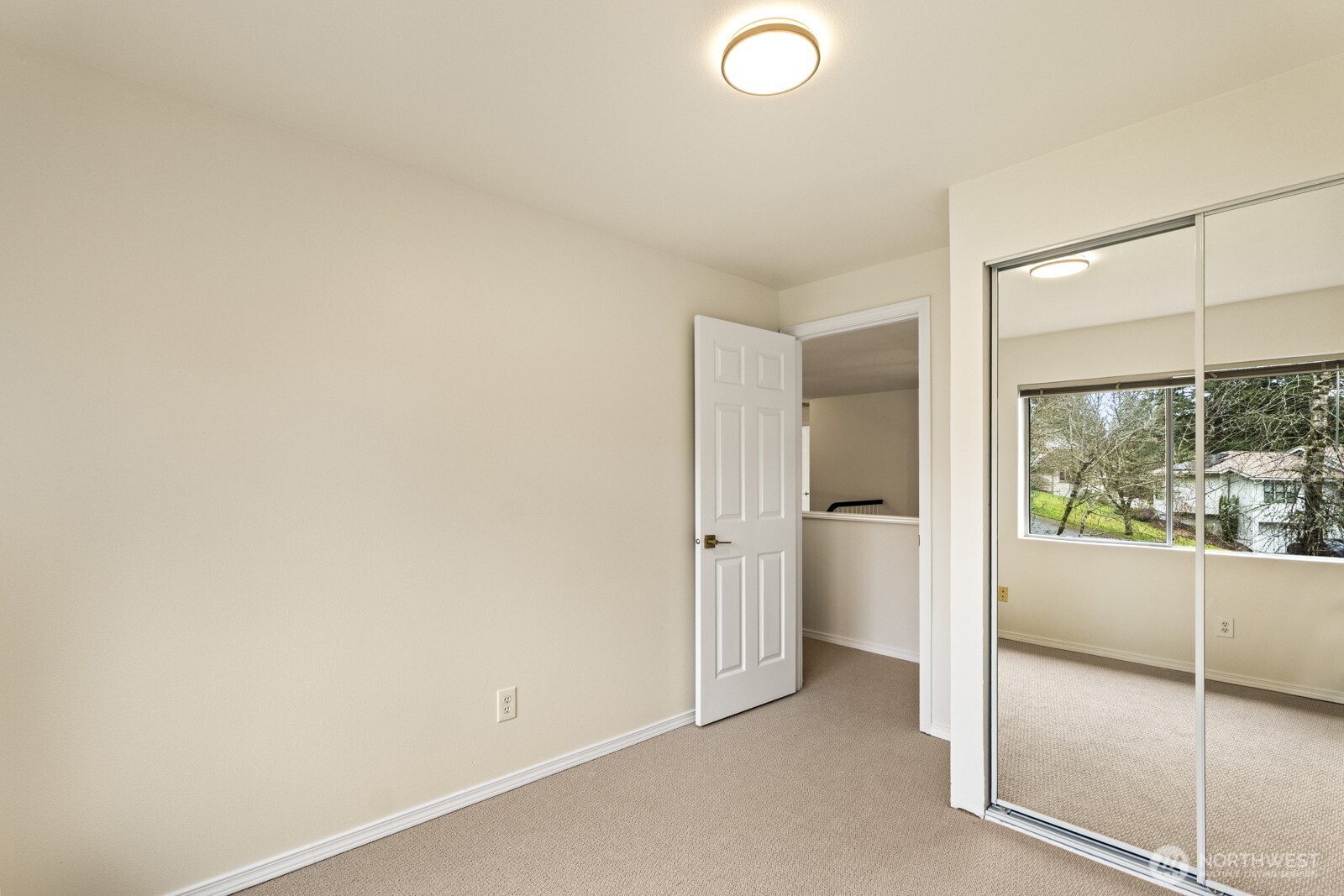 4th bedroom with mirrored wardrobe doors.