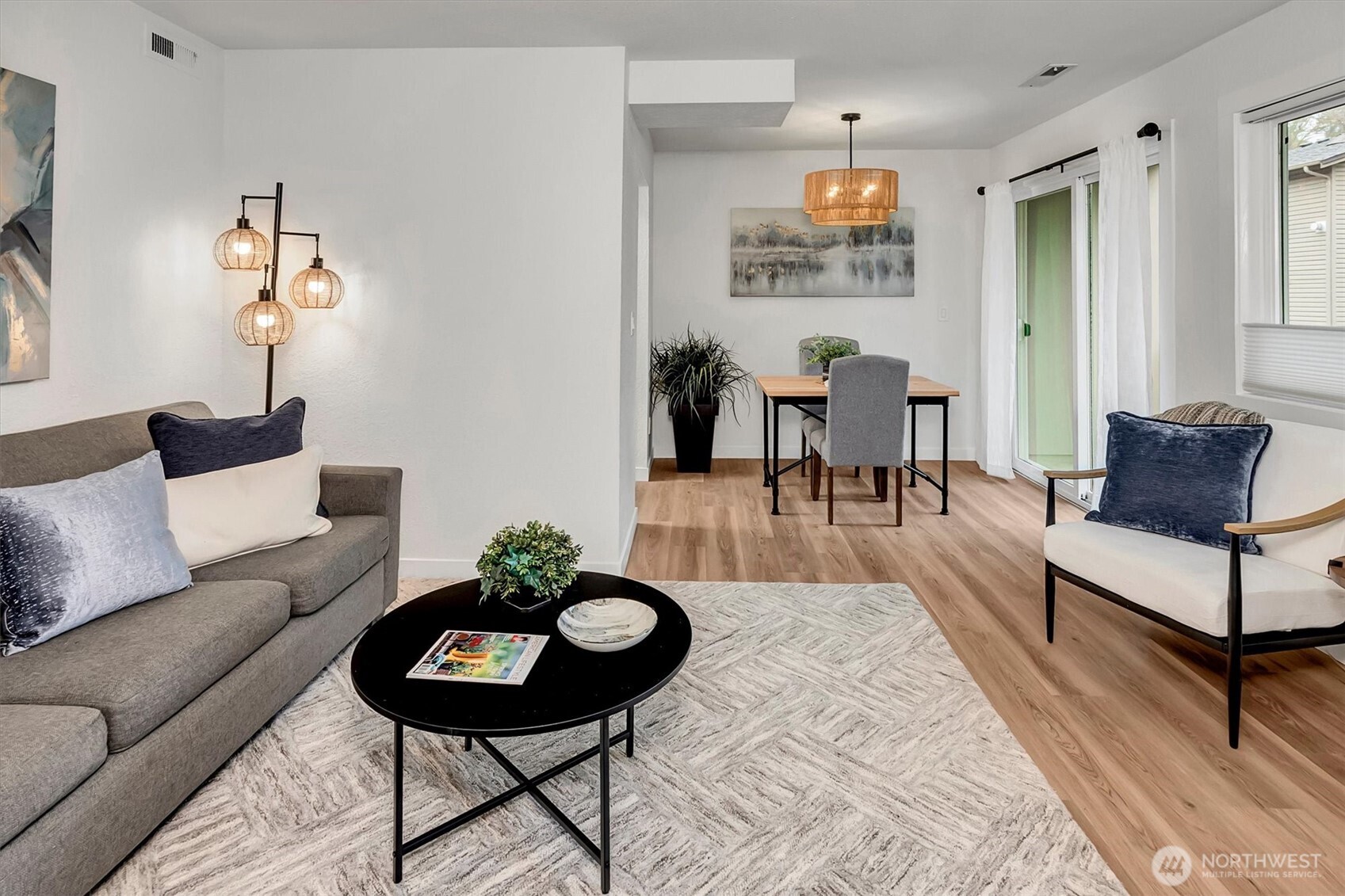 There's ample room to host guests.  Living room could easily accommodate an "L" shaped sofa or sectional.