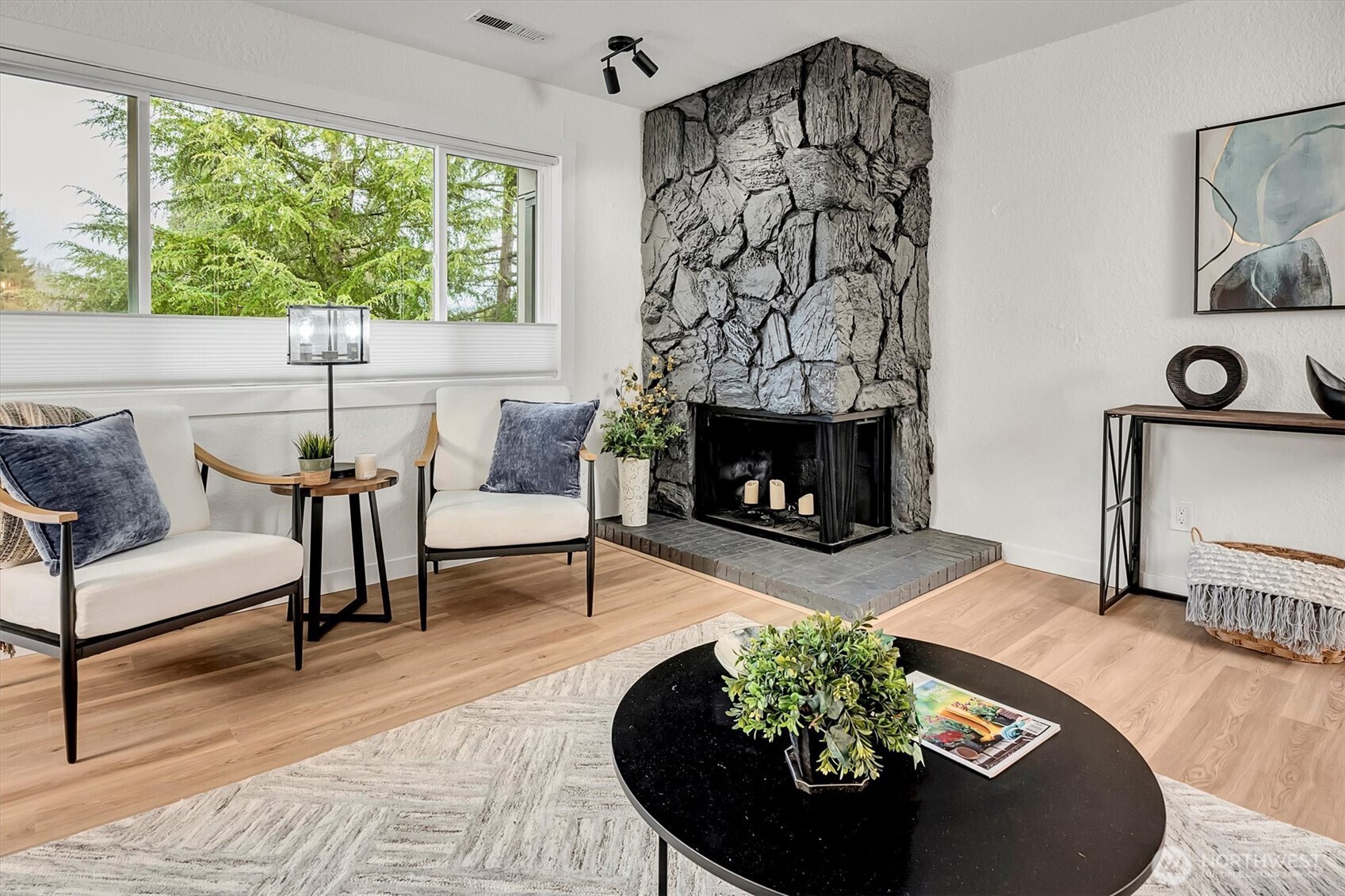 Fireplace is wood burning, however, with an electrical outlet near the hearth you could easily add an electric fireplace insert.