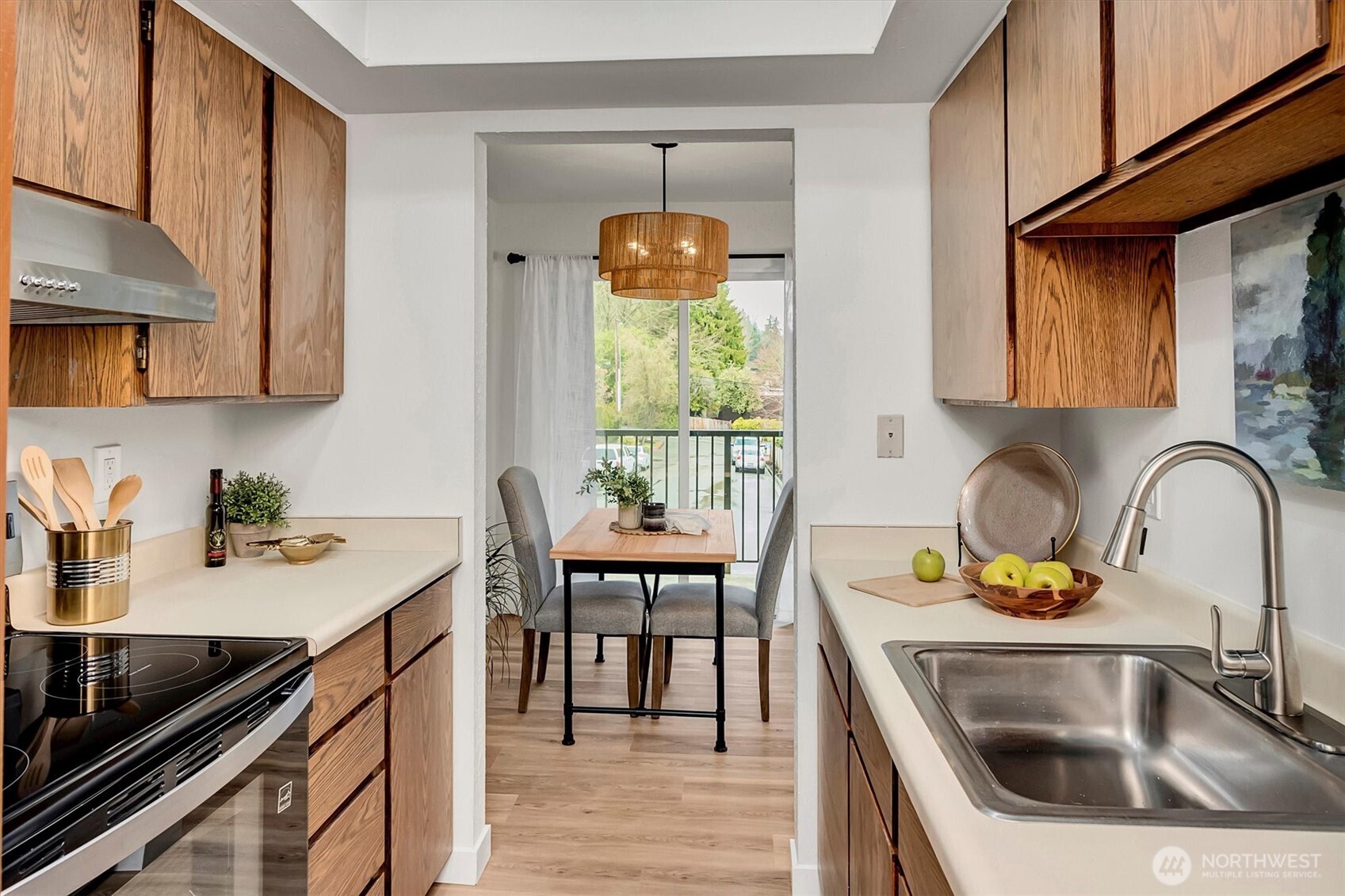 The kitchen offers tons of storage and brand new stainless steel appliances.