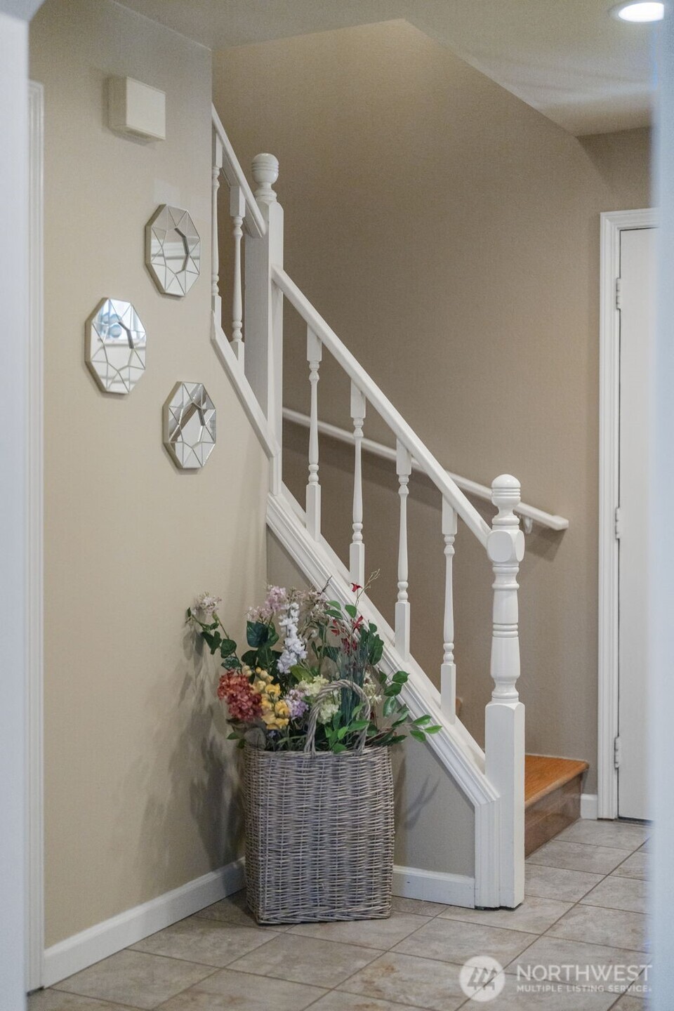 Classic curb appeal welcomes you home with a well-kept exterior, mature landscaping, and a spacious corner lot setting.