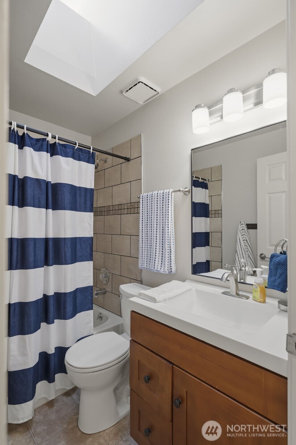 Large 2 car garage offering great additional storage above in the attic. The  garage door is newer.