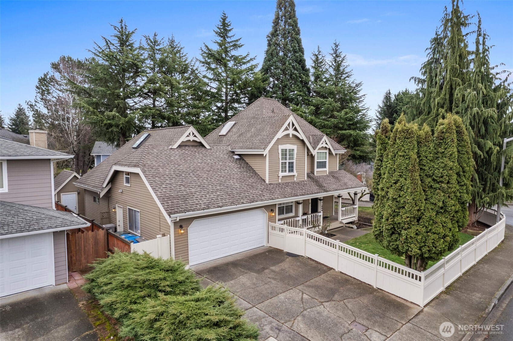 The dining area connects seamlessly with the kitchen, where bar seating and a casual eating space create an inviting hub for meals, conversation, and entertaining.