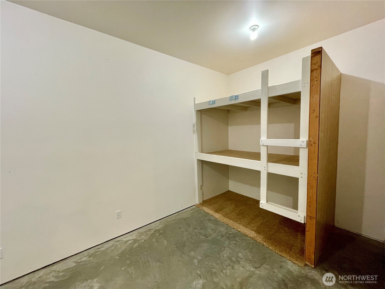 This is a large room which was framed (prior to sheet rock and siding) for a 2nd door and 2 egress windows. Potential for 1 or 2 Bedrooms