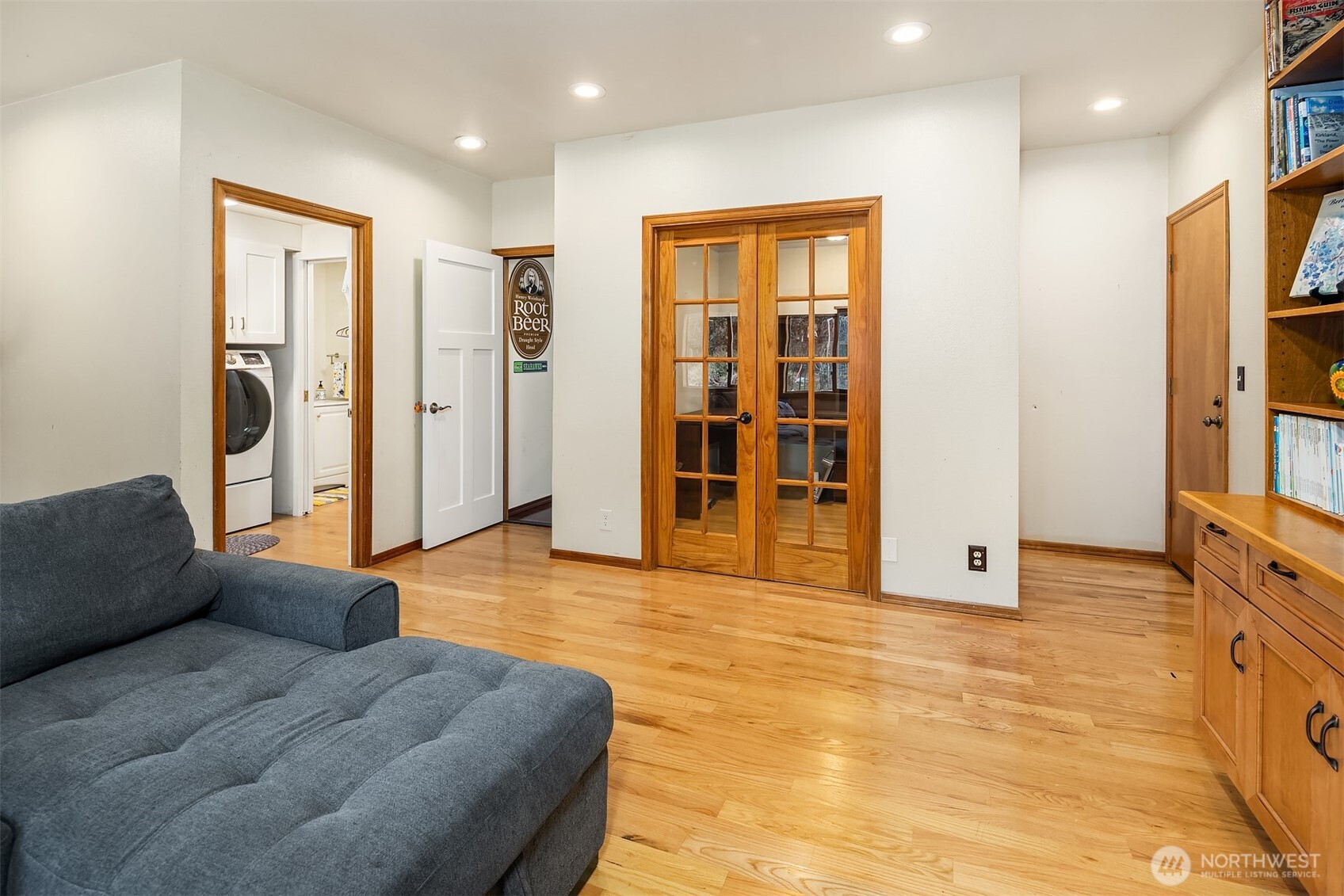 Attached to the family room are the french doors to the den/office.