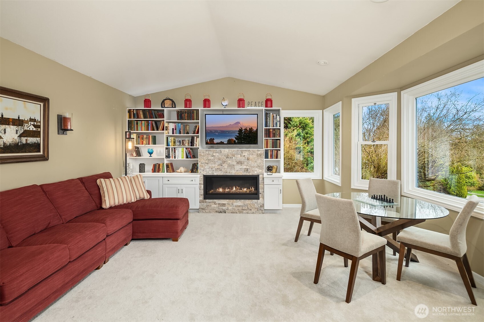 Large picture windows in the living room bring in light and mountain views.