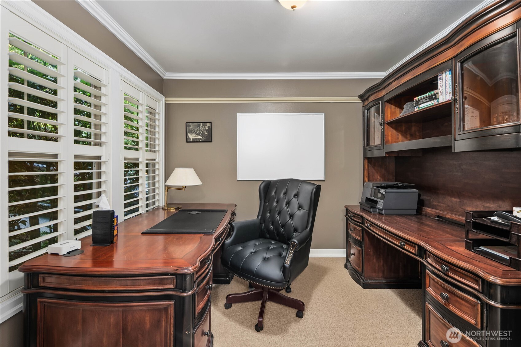 Spacious and inviting family room with hardwood floors and easy access to the outdoor deck.