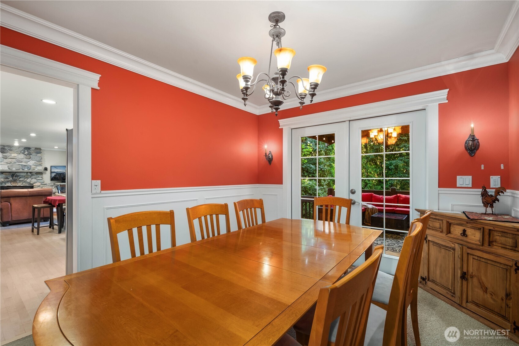Dedicated executive home office with expansive built-in wood cabinetry and a large workspace.