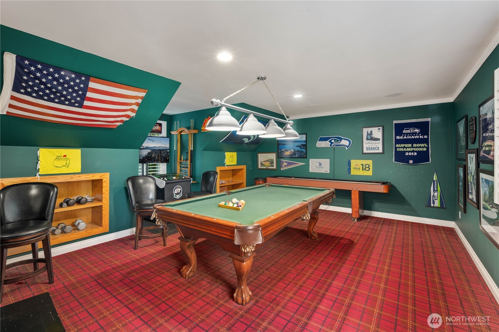 Ultimate entertainment space featuring a classic pool table and dedicated "fan cave" decor.