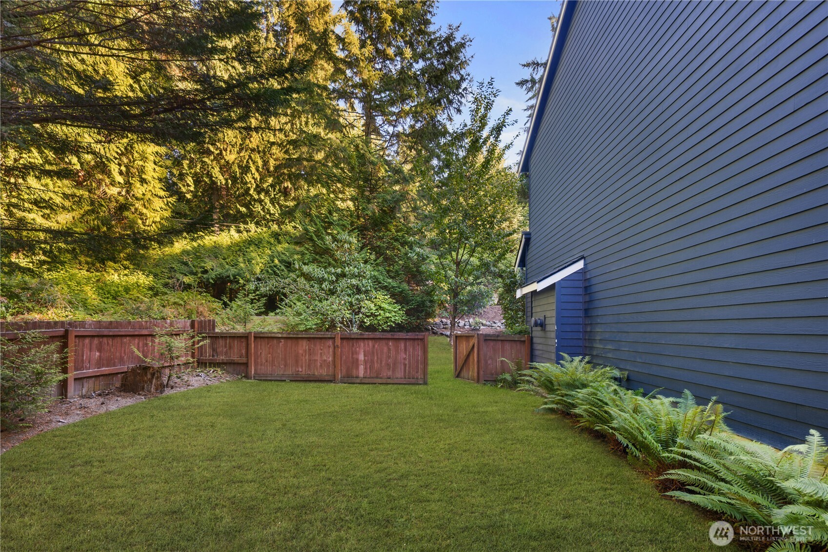 Level, fenced side yard provides a secure and private lawn area for pets or play.