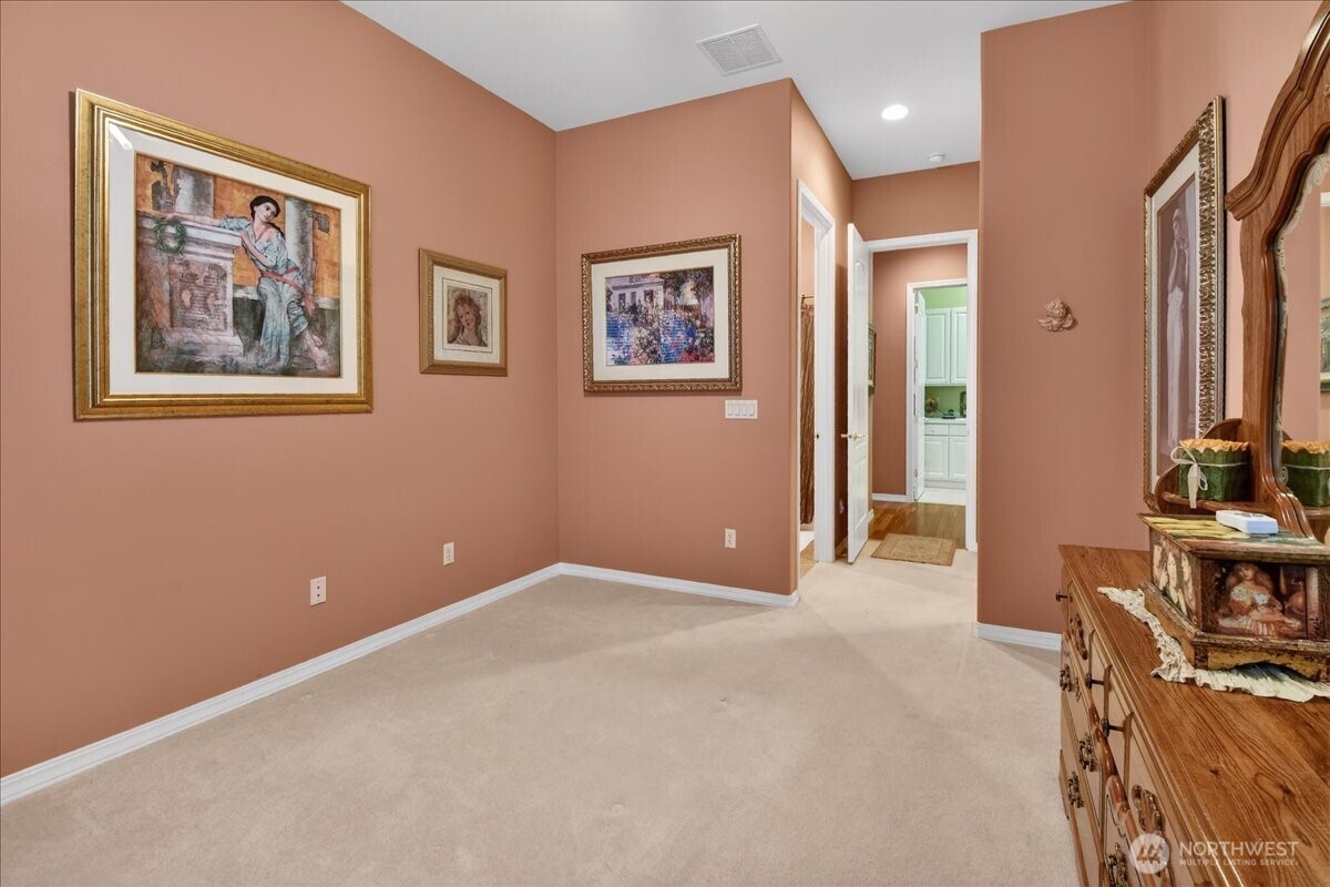 Your brightly decorated, 3-car garage hosts dual power garage door openers, loads of ceiling storage racks, wire shelving, three stylish, metal storage cabinets, work bench, 220-volt electric car charger, and a GE Profile side-by-side backup refrigerator/Freezer.