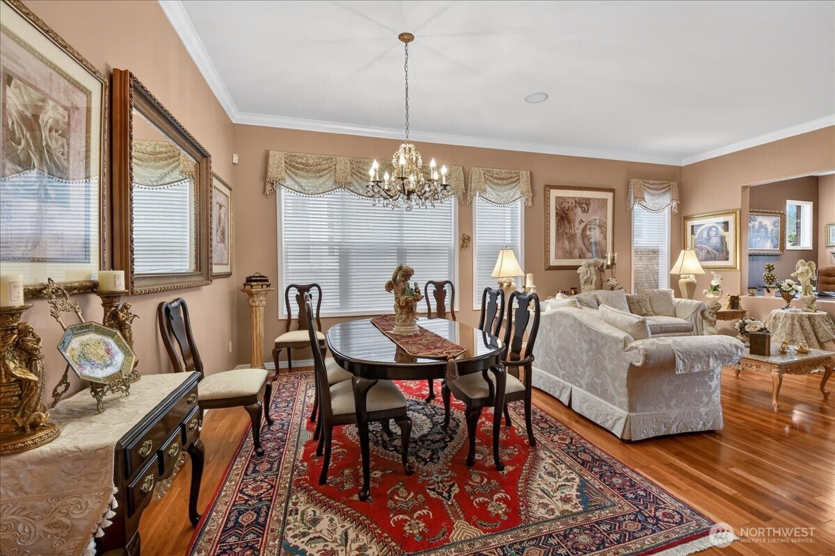 Elegance abounds with a stately chandelier, China cabinet, and whole-house sound system to set the mood.