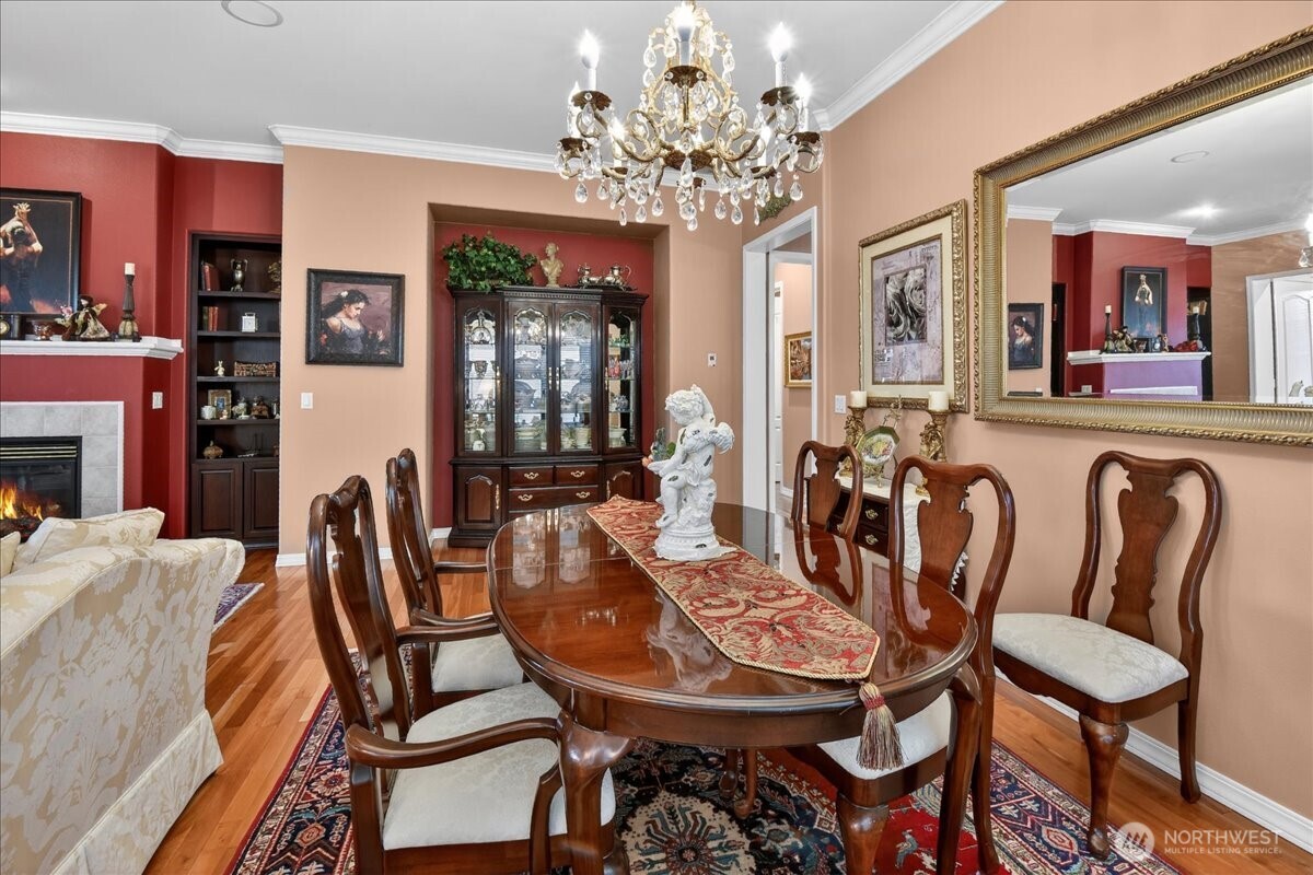 Spacious and warm, you'll enjoy preparing snacks and meals in this well equiped Kitchen with SS Appliances, Pendant lighting over an occomodating center Island, Pullouts with no center stiles, recycle & refuse bins, granite counter-tops and full-height backsplash and French Doors with retractable Screens along the breakfast Nook.