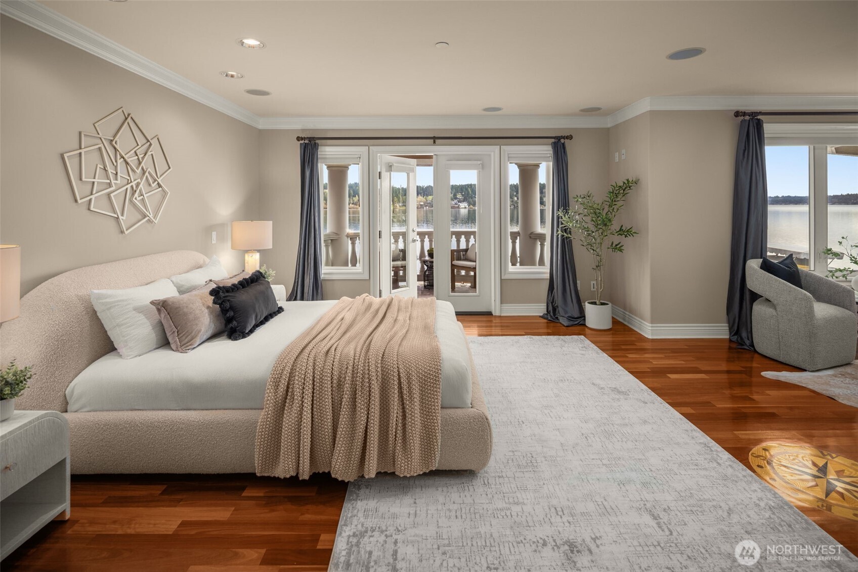 Spacious primary suite with French doors opening to your private waterfront balcony.