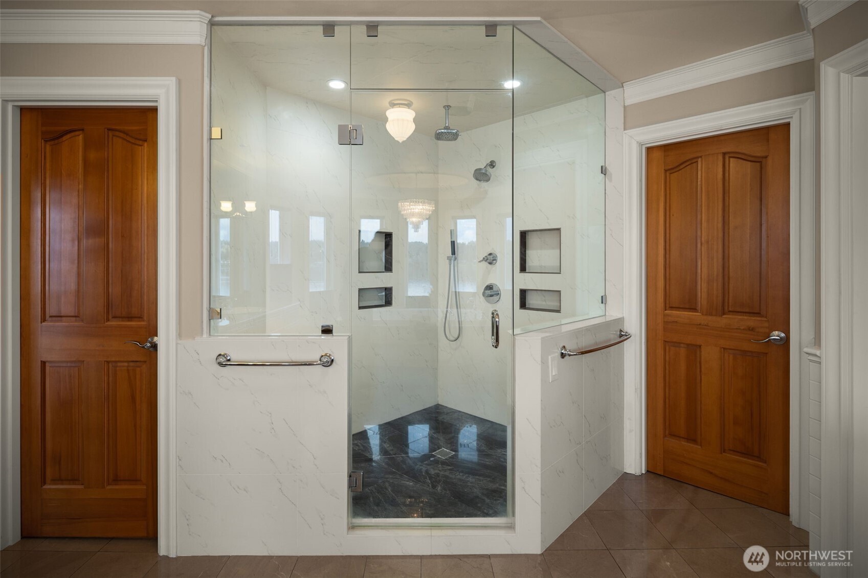Primary bath Luxury glass enclosed walk-in shower.