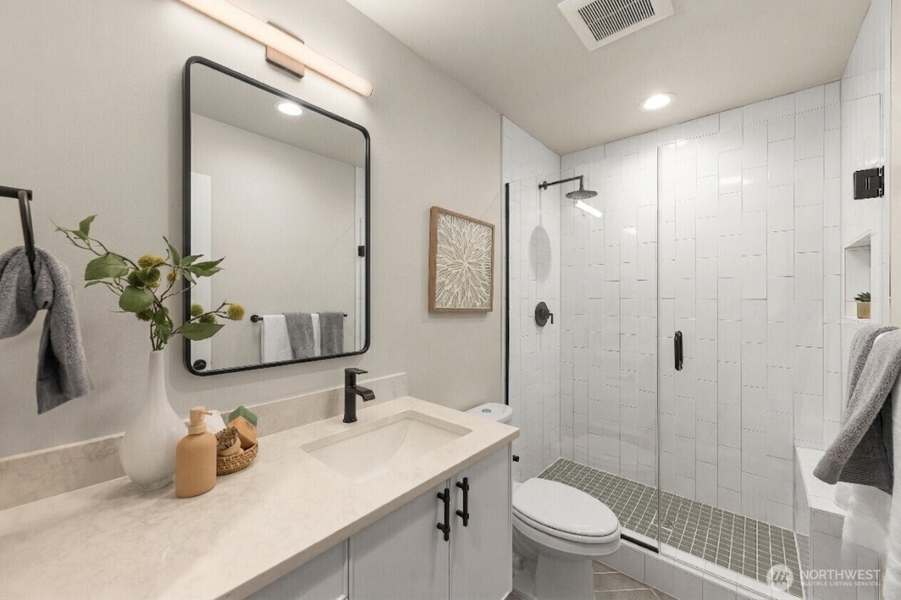 Shared bathroom with a walk-in shower, and contemporary designer tile