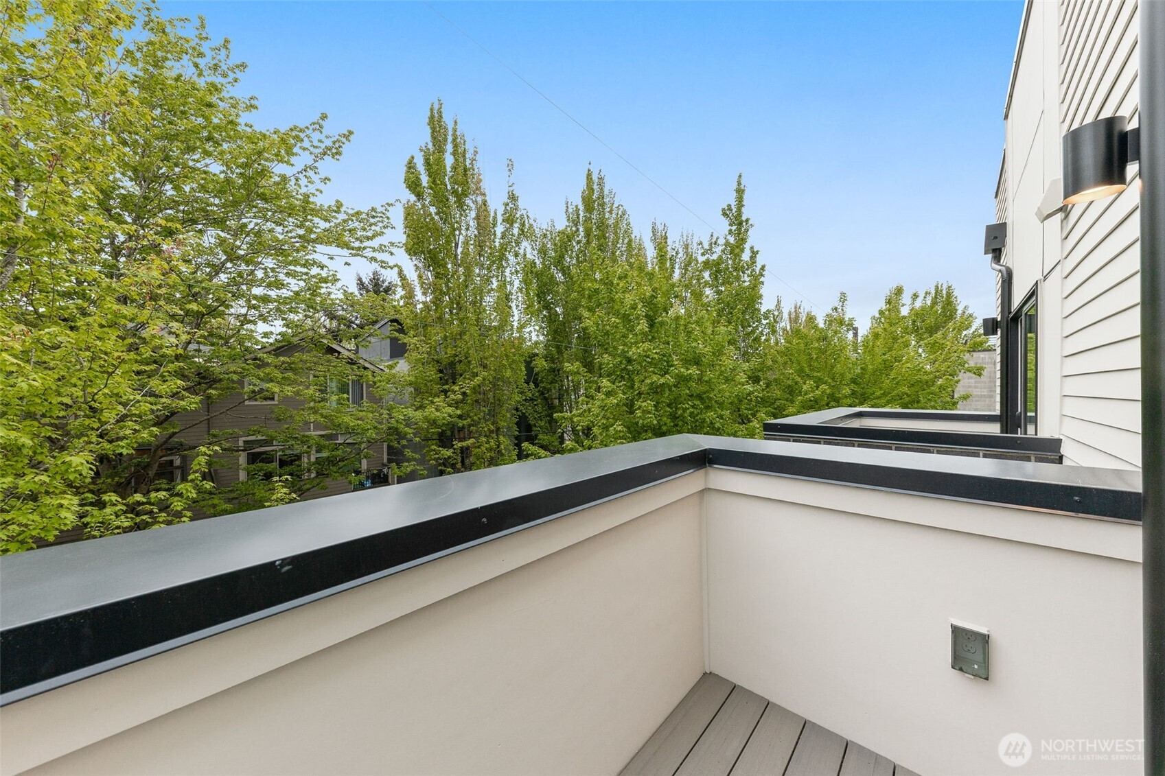 Private balcony hangs off the primary suite