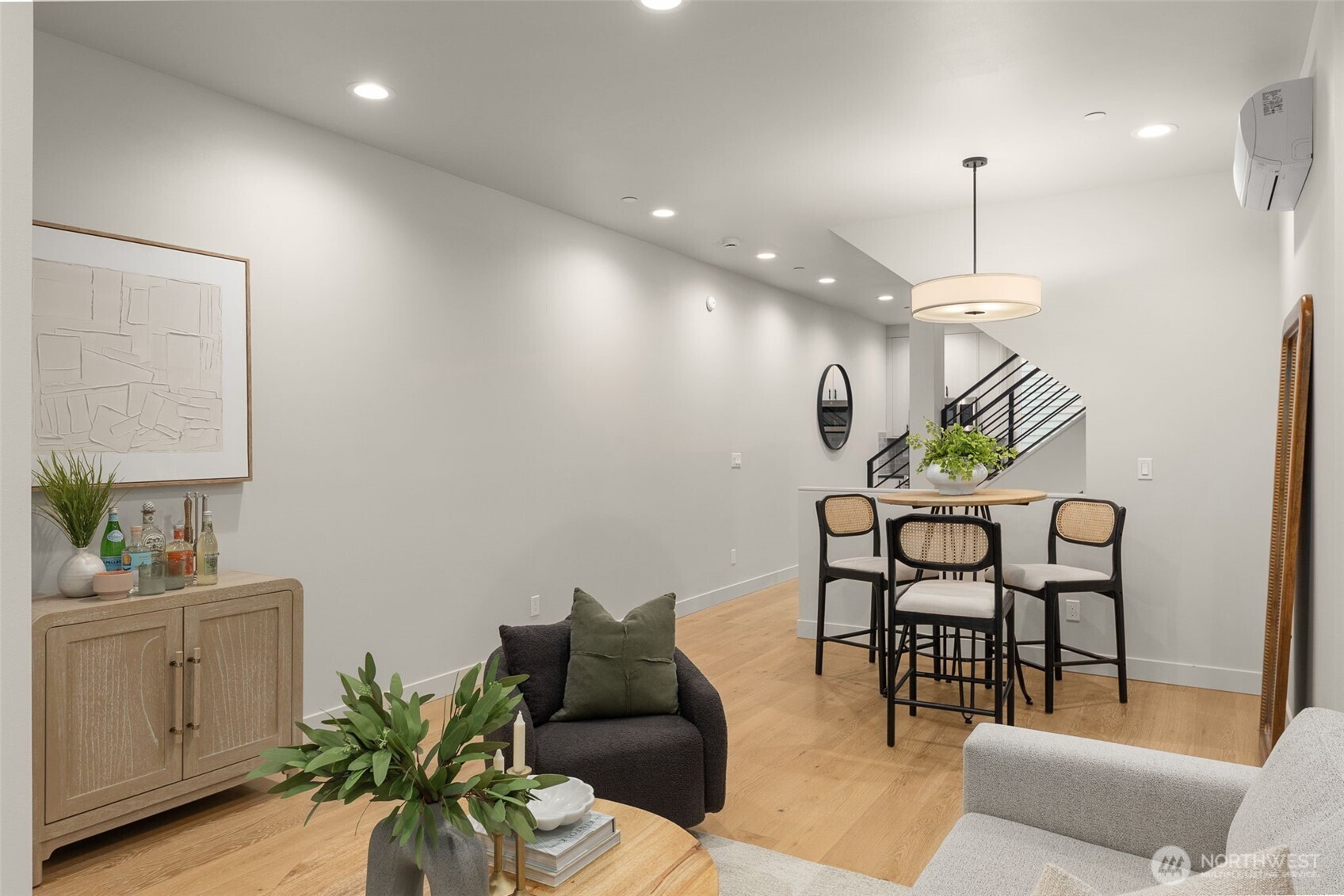 The open-concept design flows effortlessly from the kitchen to the dining area, ideal for modern living.