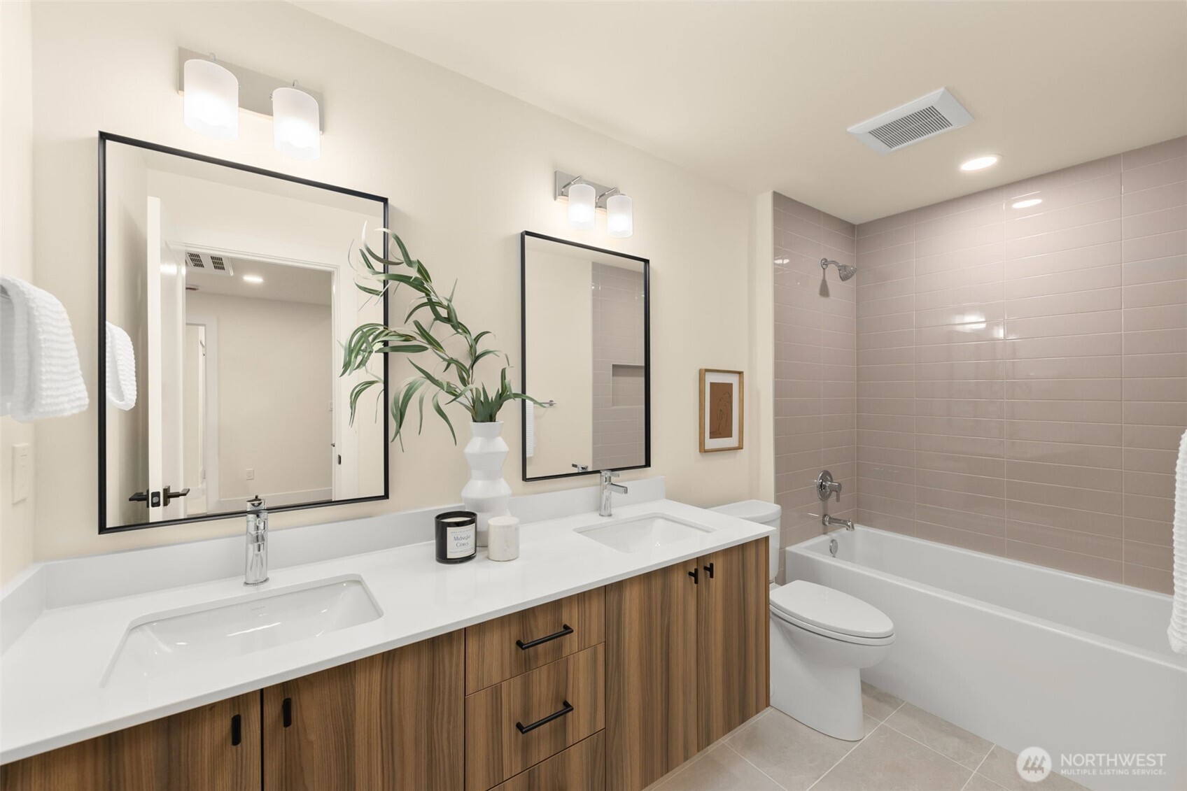 Upper full bath with dual sinks.