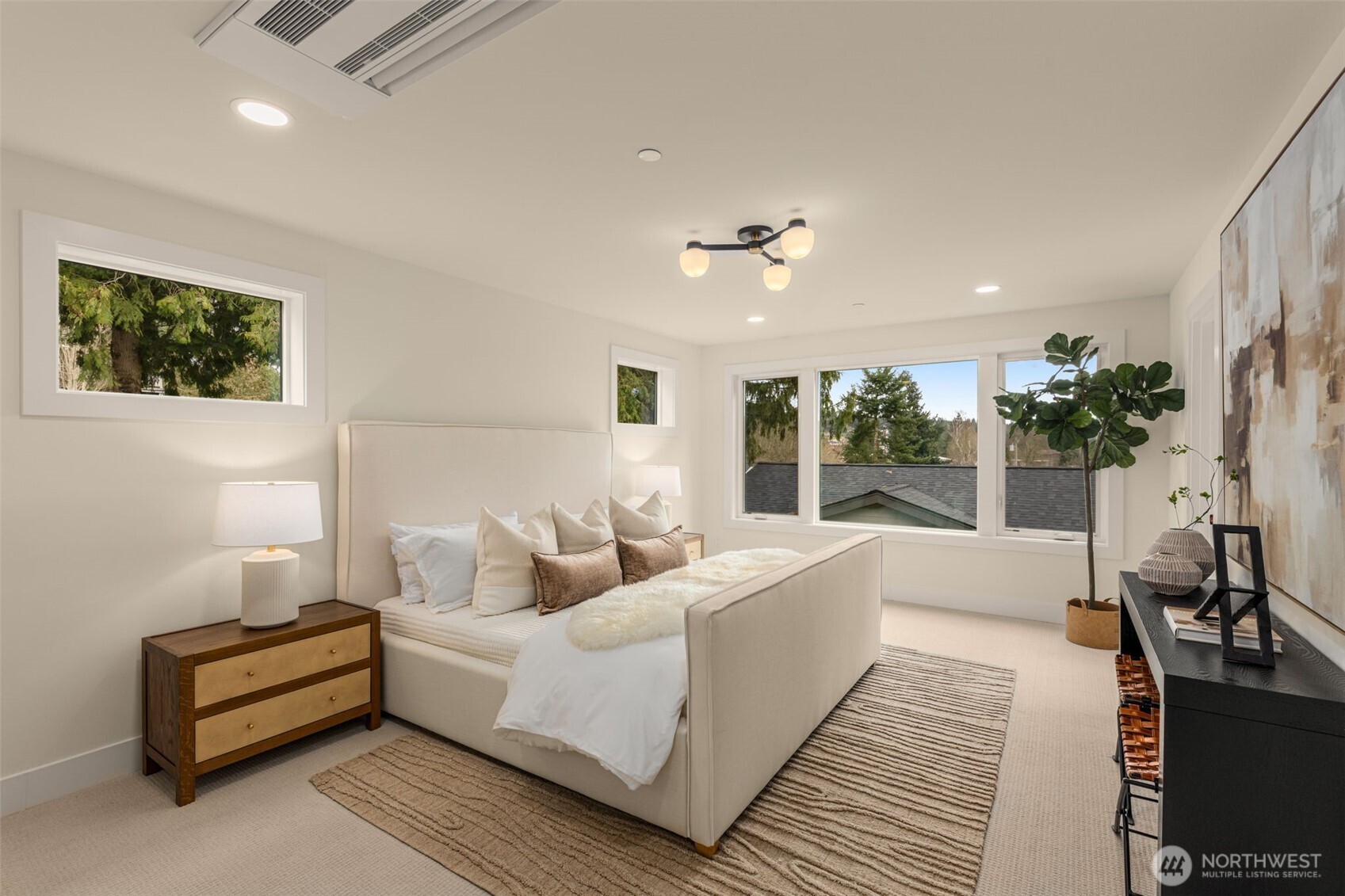 Retreat to the primary spa-like bath with heated tile flooring.