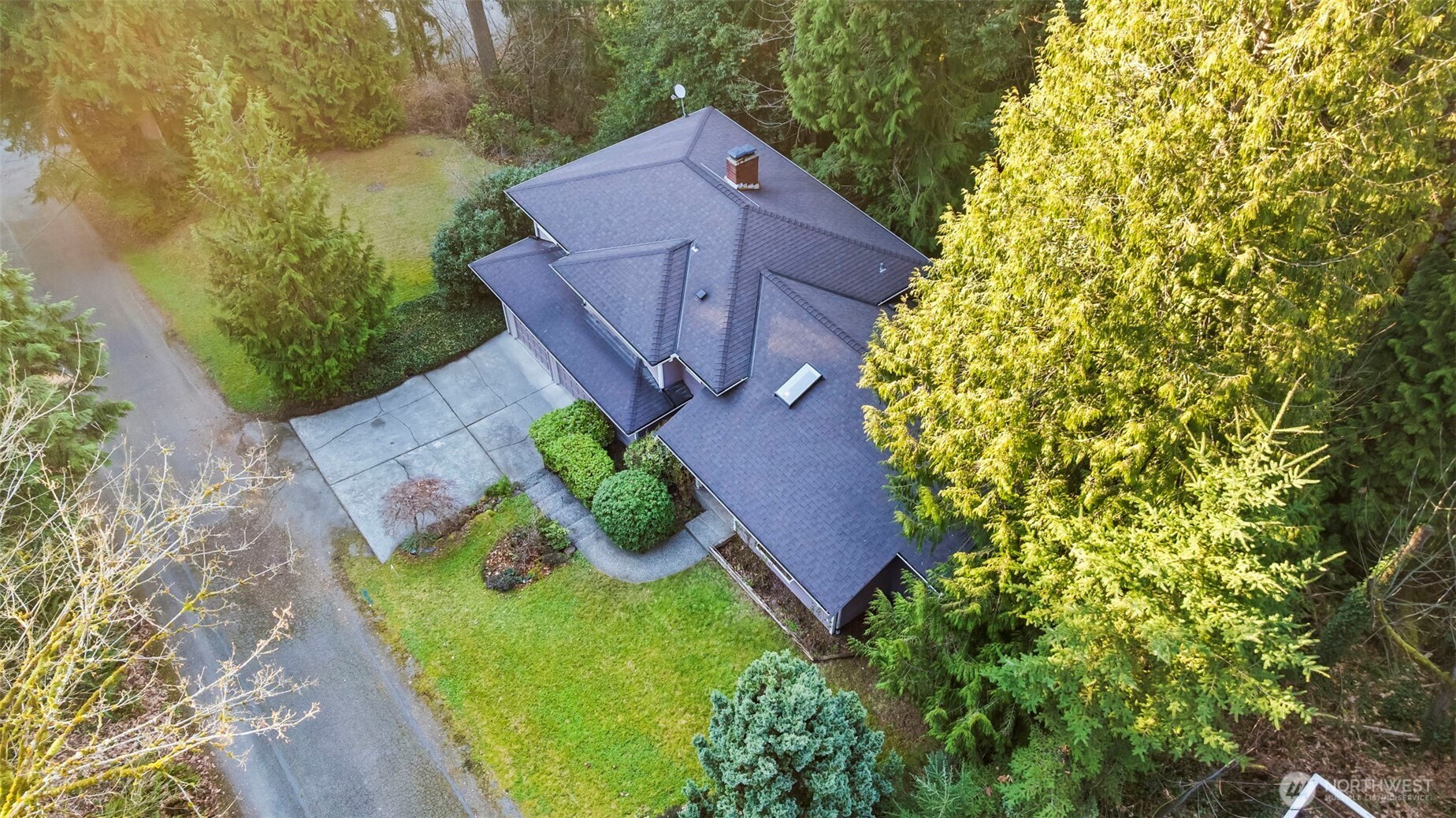 Angle from the side of the property showing all the extra lawn areas.