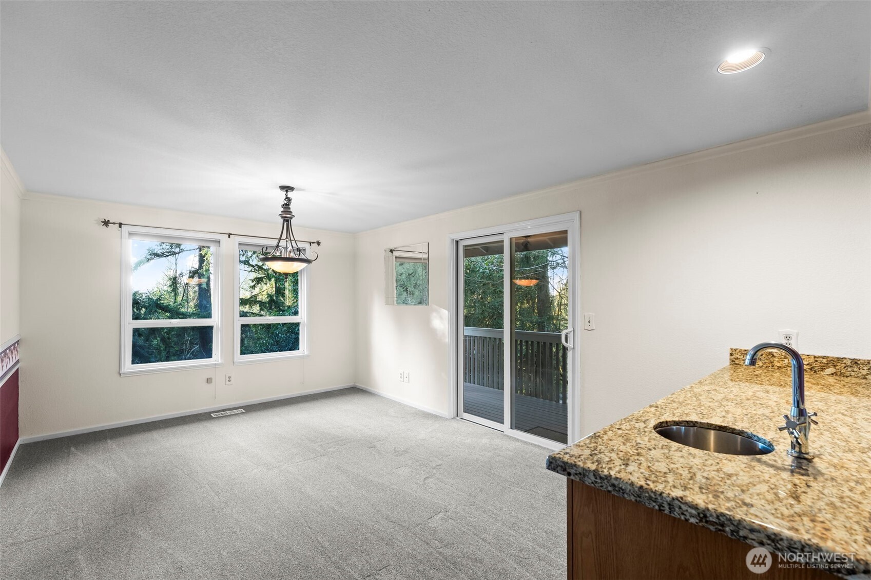 Large extra eating area off the kitchen makes a great gathering place.