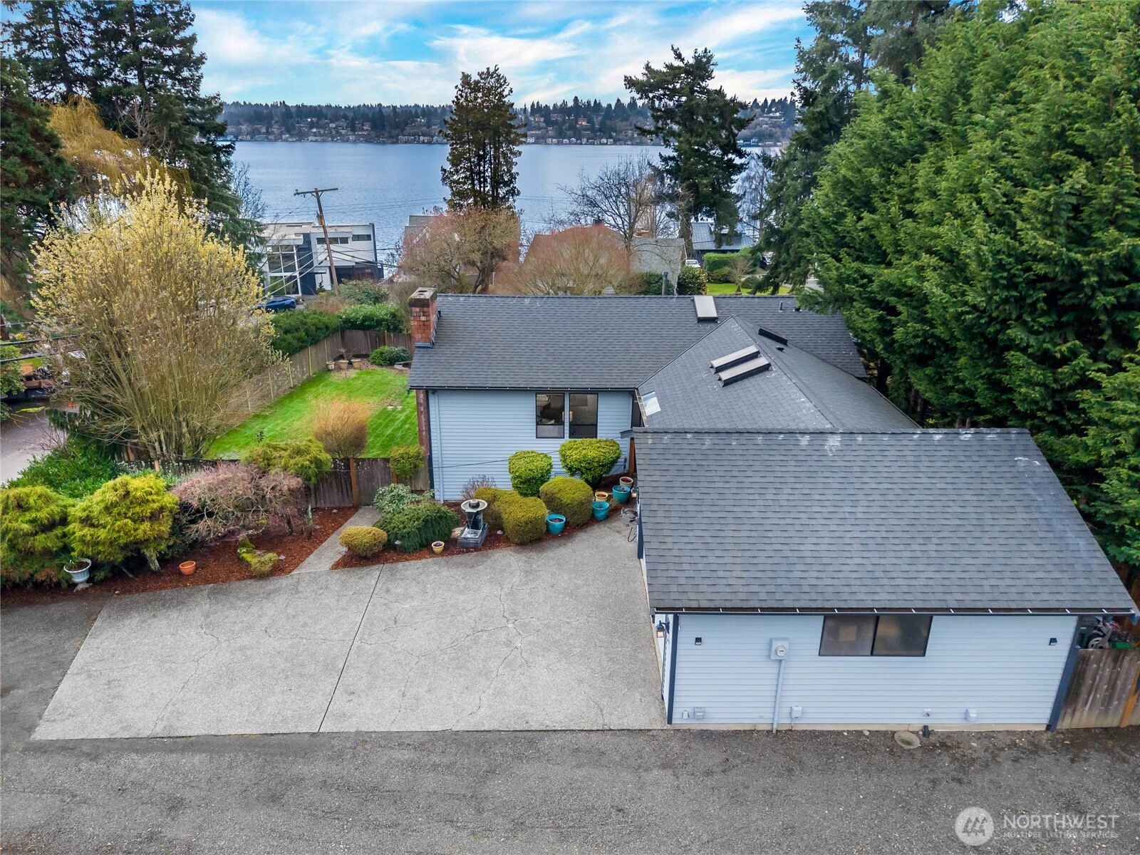 Great room entry with a wall of windows facing Lake Washington