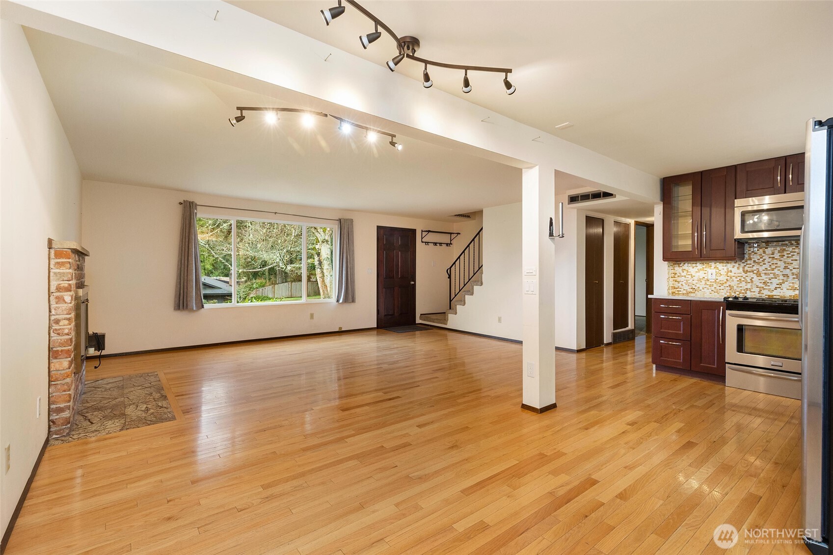 Hardwood floors flow seamlessly throughout the main living area