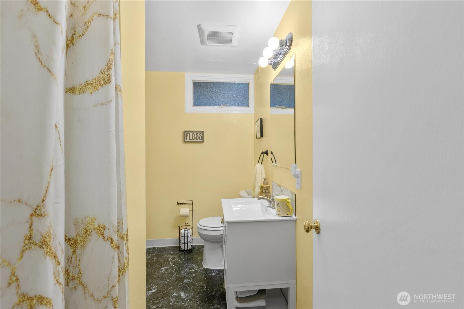 Lower-level bathroom with shower and updated vanity.