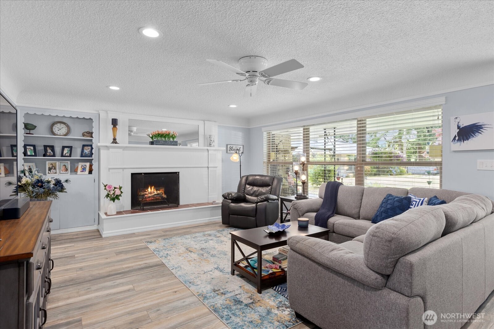 Large picture windows fill the living area with natural light.
