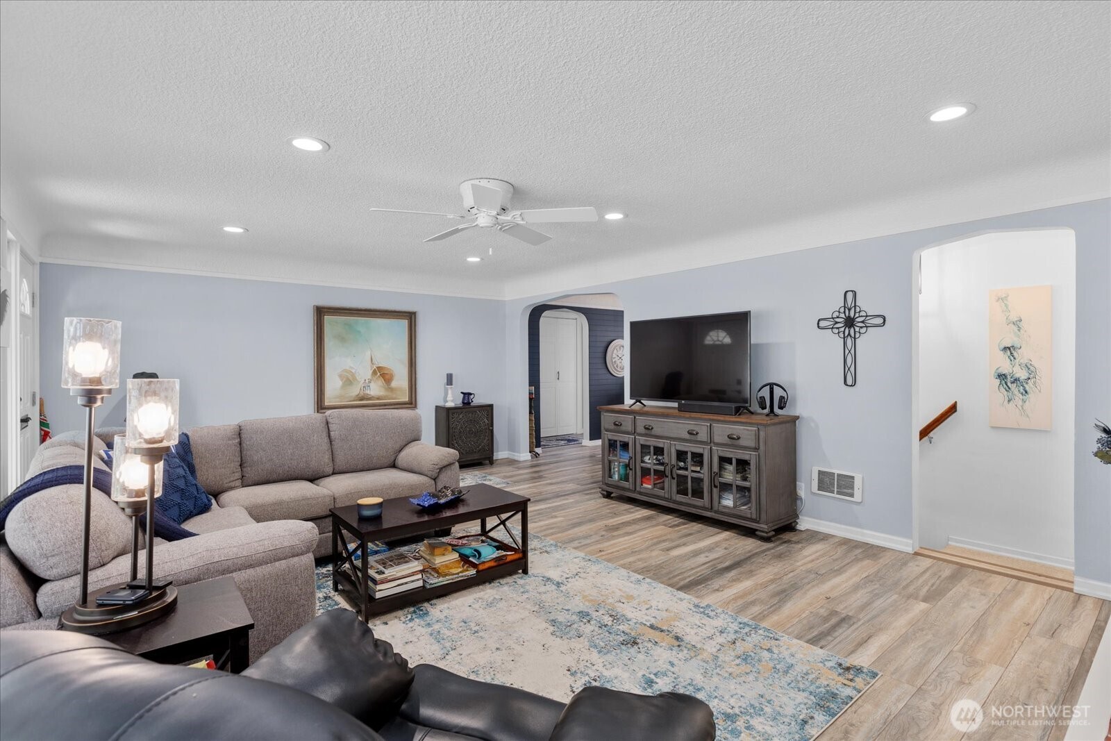 Elegant archways connect the main living spaces.
