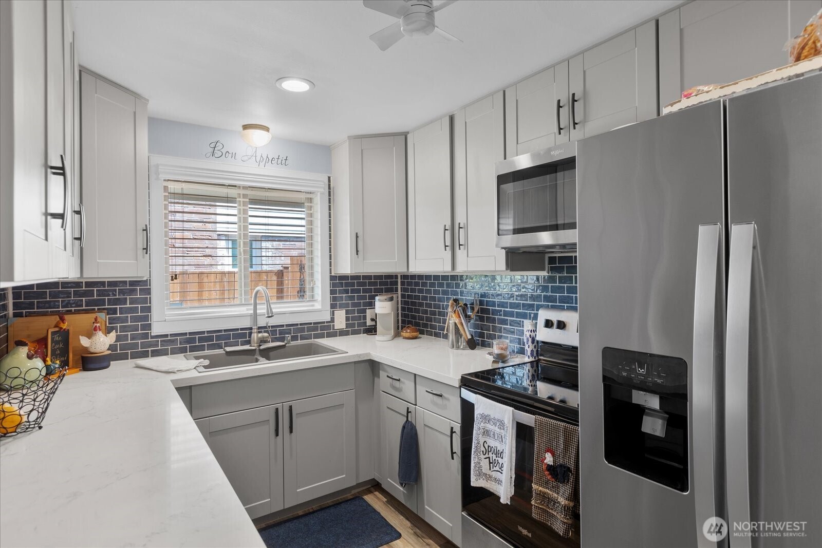 Thoughtfully updated kitchen with modern finishes and ample counter space for everyday cooking.