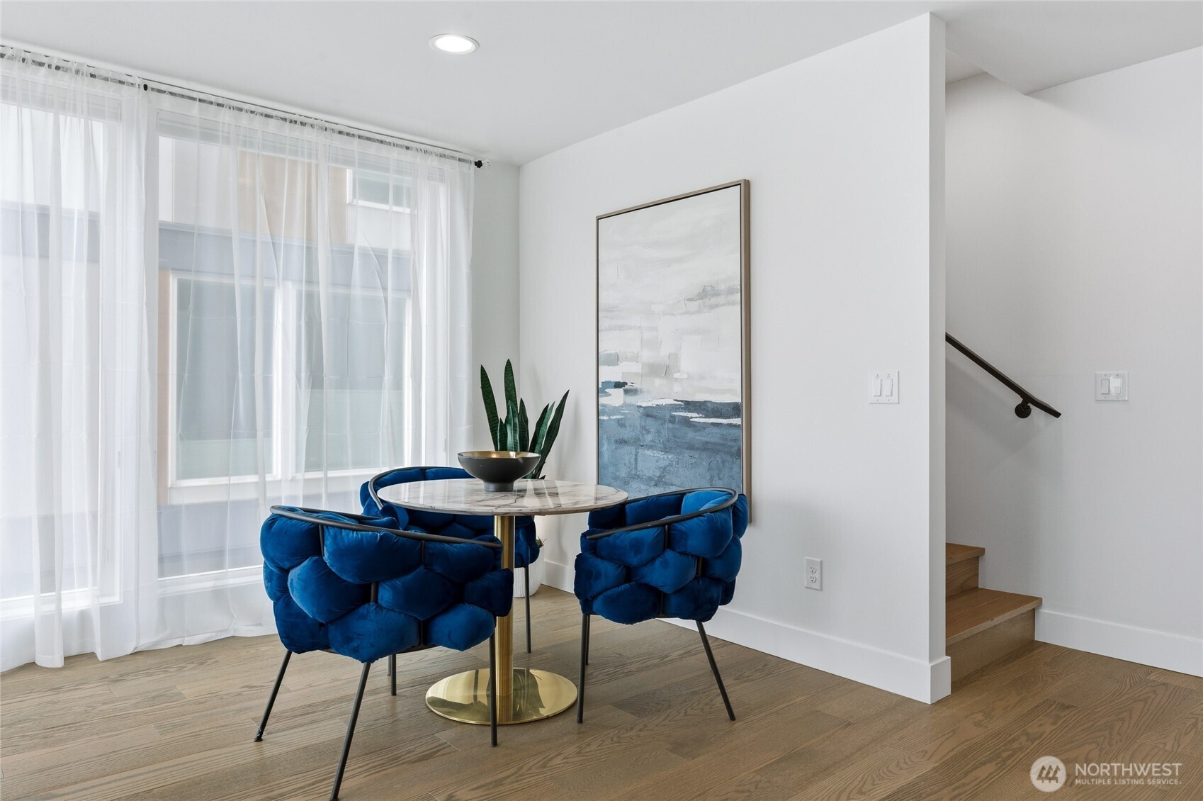 Powder room for guests with impeccable modern design and tile wrapped wall