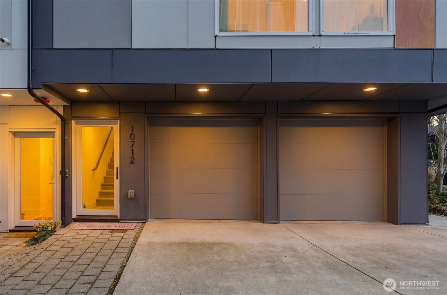 Another bonus - an oversized laundry room with an utility sink, built in cabinetry and additional storage room.