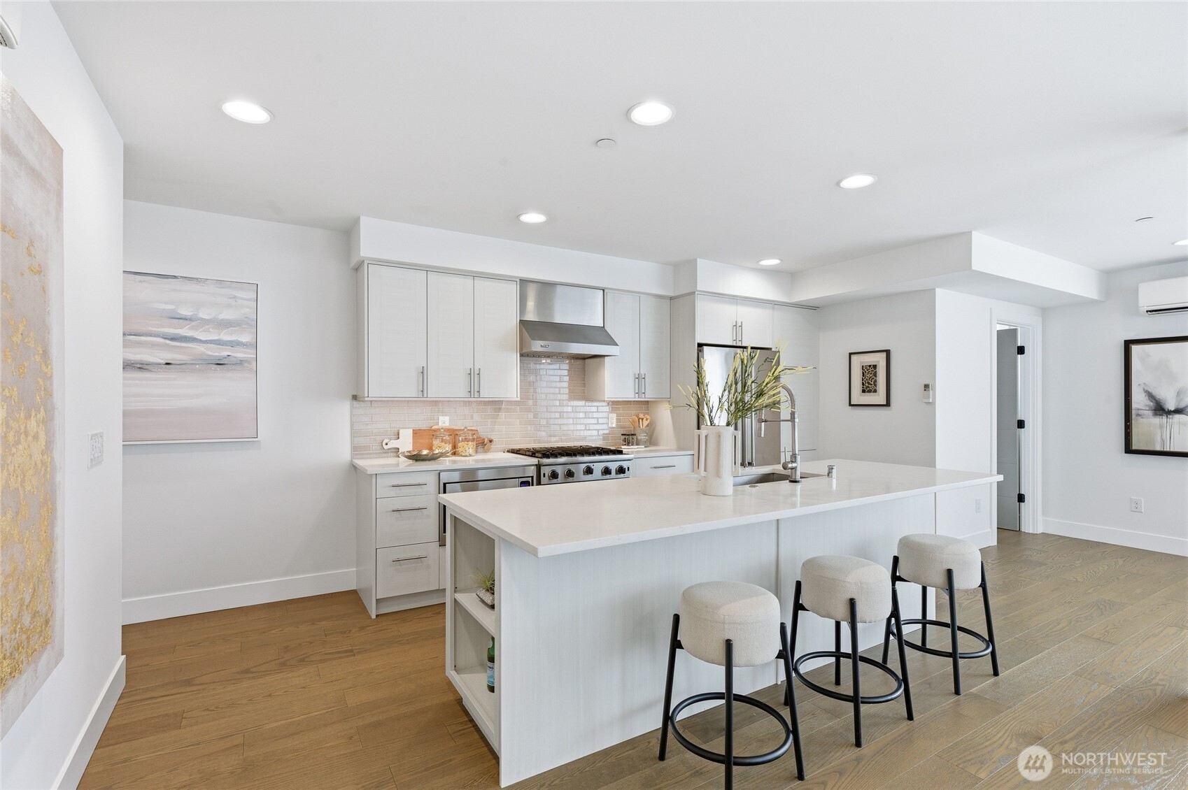 Open layout, floor to ceiling, windows and sunlit rooms