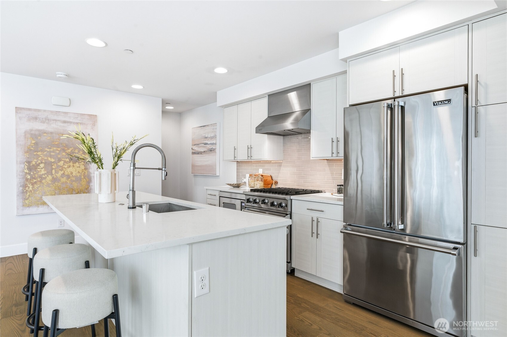 Gourmet kitchen with high end Wolf, Viking appliances, and ample storage spaces.