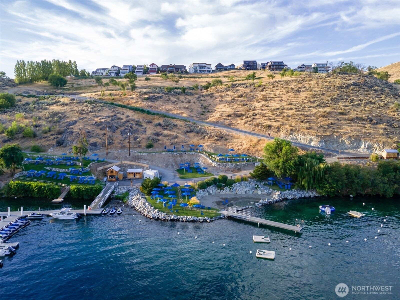 Aerial view of waterfront and marina.