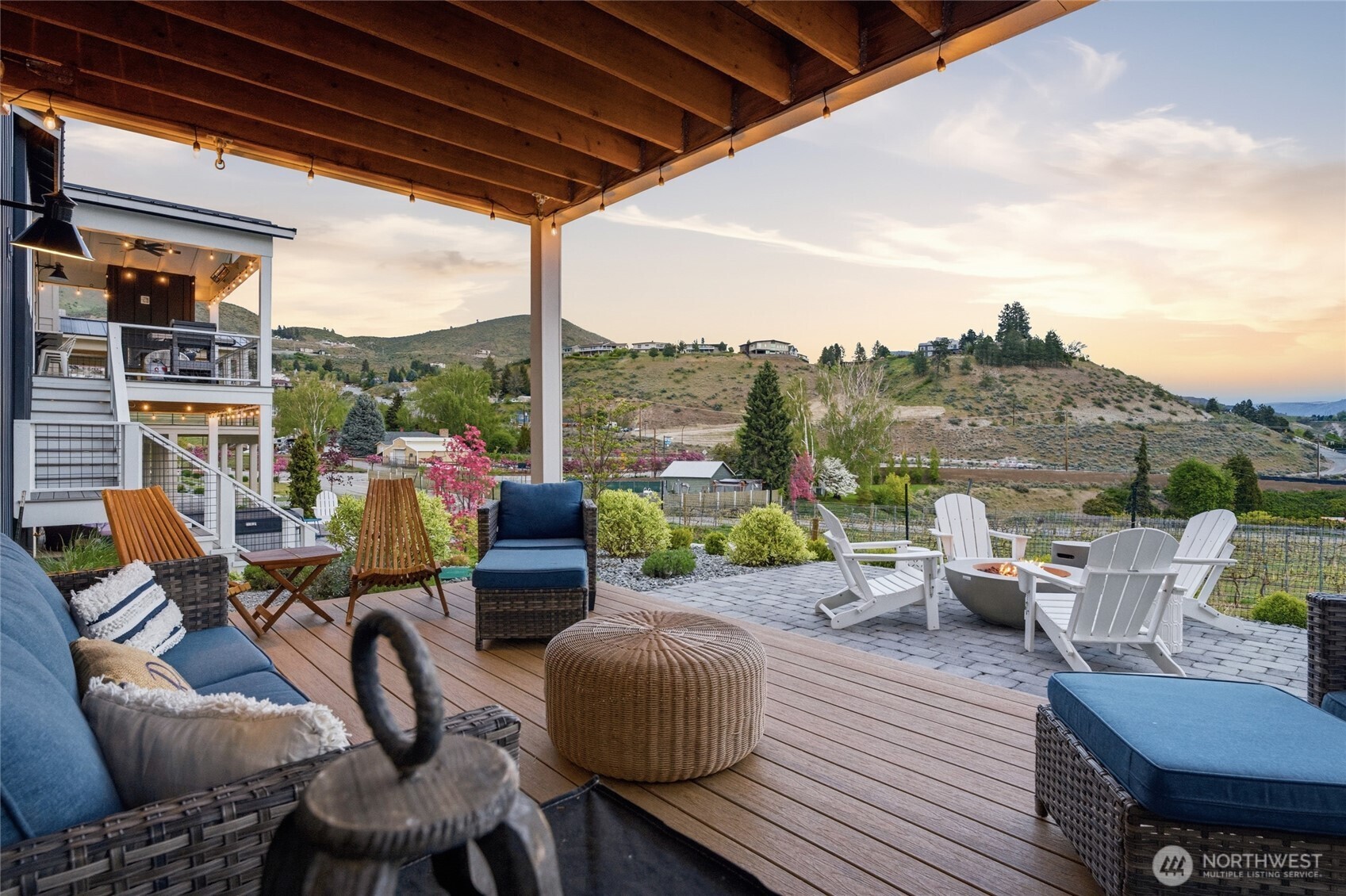 Twilight view of lower level outdoor living area.