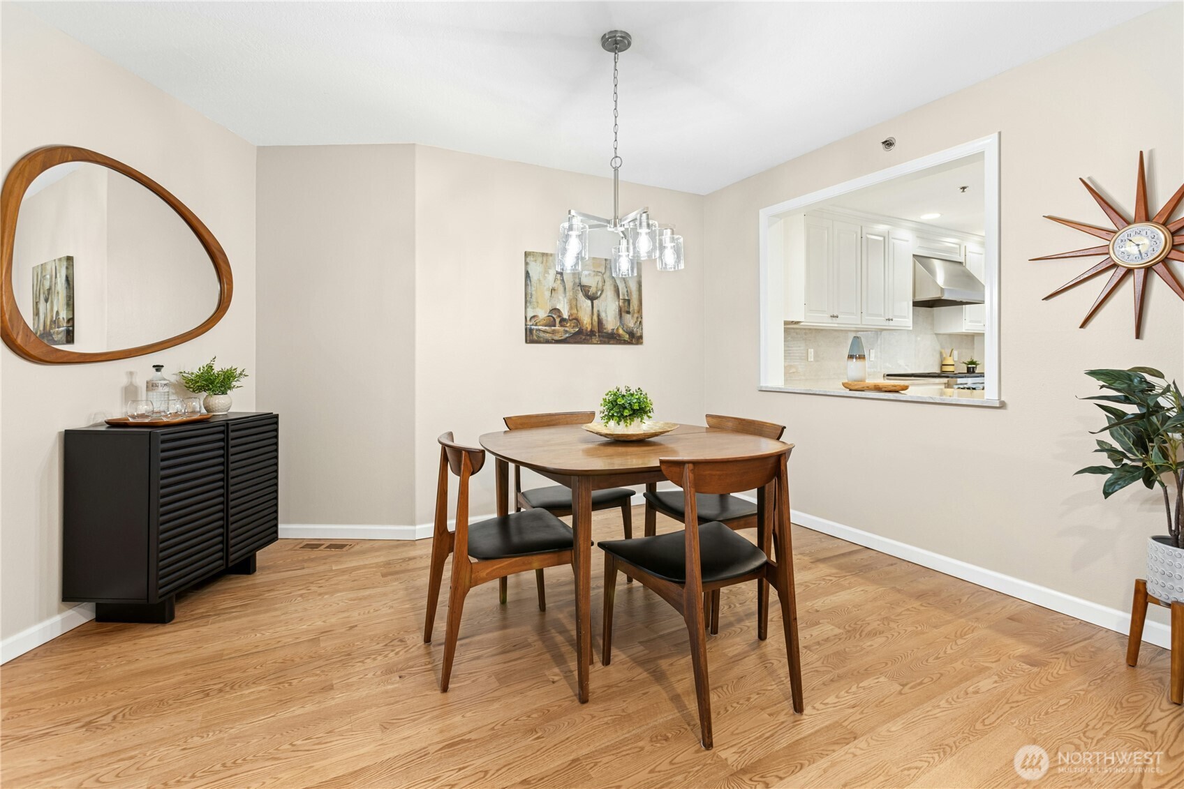 The dining room has a new light fixture and a convenient pass-through to the kitchen.