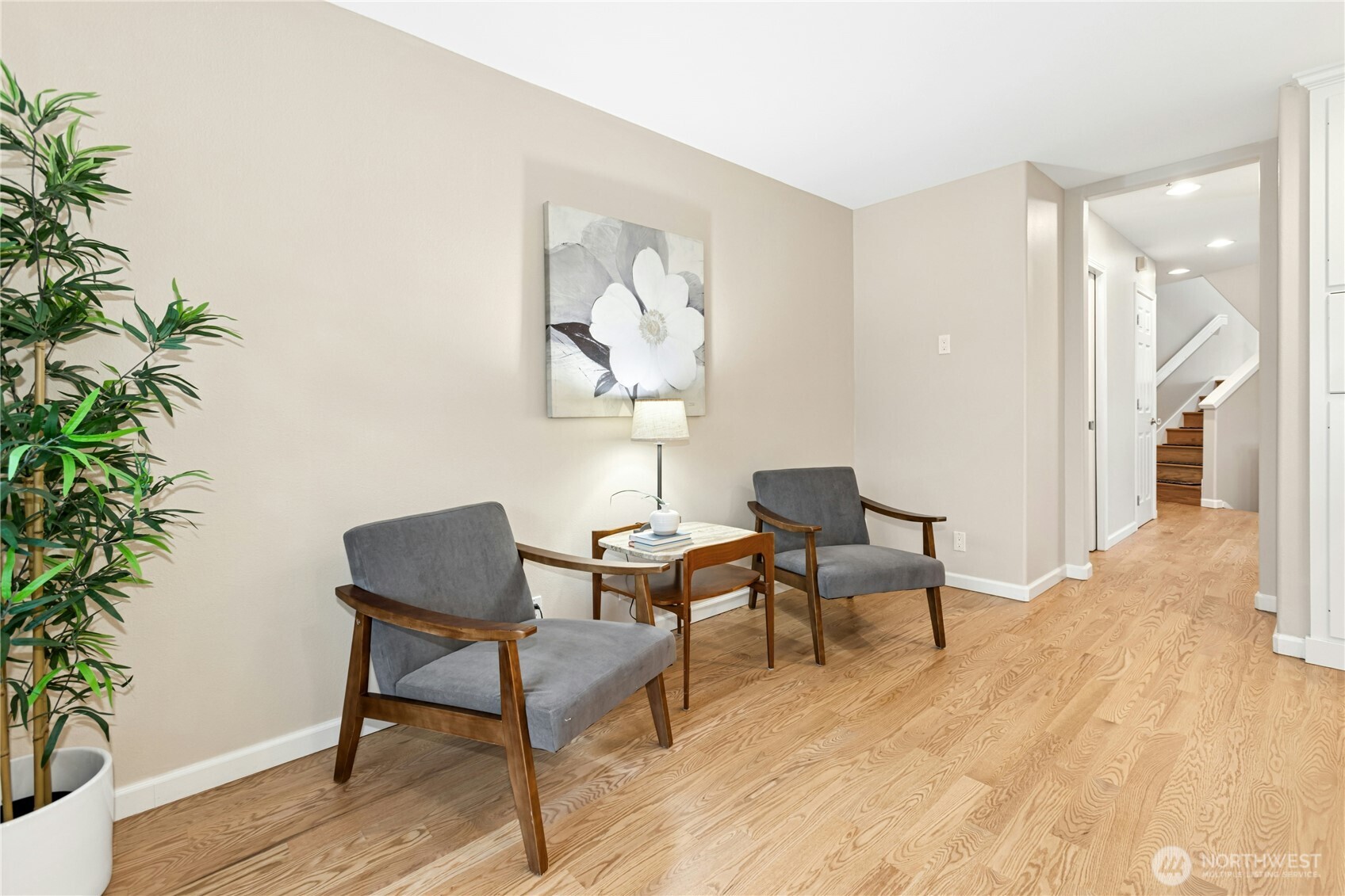 View from the kitchen to the main level powder room and dining room. Another notable upgrade: interior doors have been replaced with solid wood doors and new door hardware.