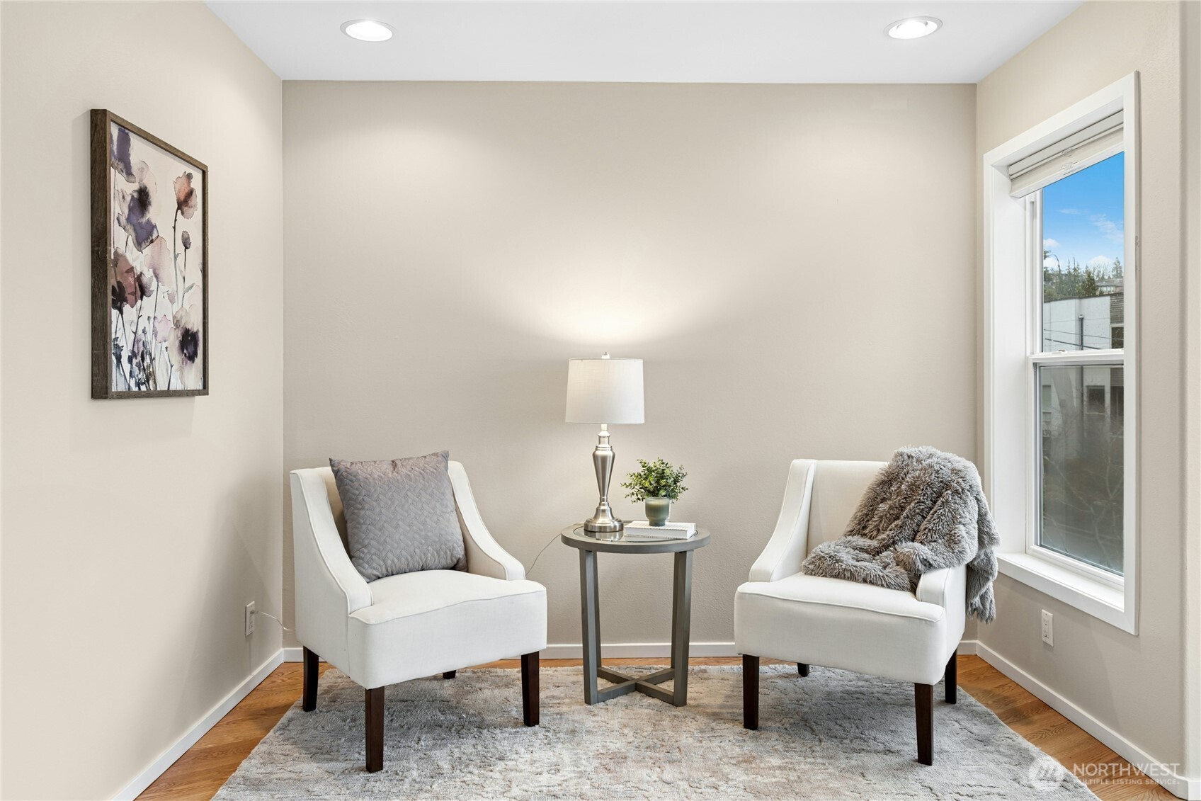 This primary suite has this space which is perfect for relaxing with a glass of wine while you enjoy the lake views.