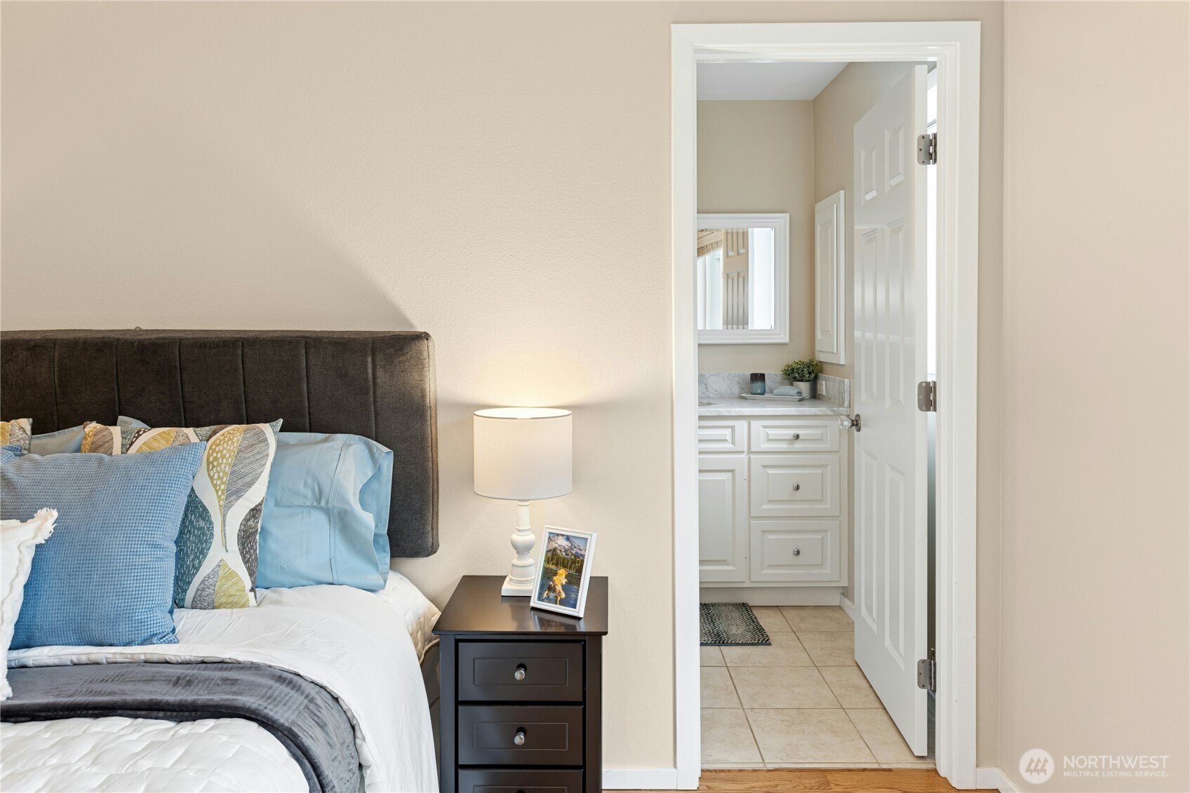 The second bedroom upstairs has it's own full bath with tile floors and new vanity.