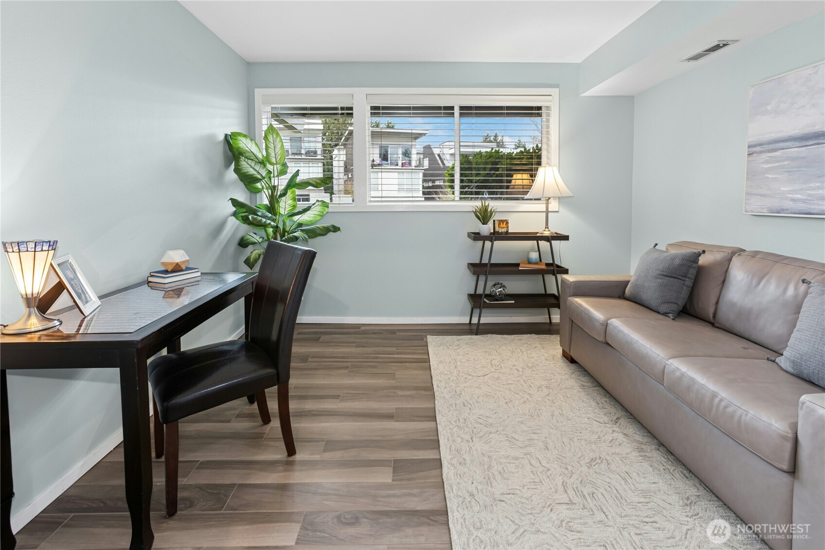The third bedroom on the lower level has tile floor, fresh paint and a reach-in closet. Bedroom is currently staged as an office. How would you use this space?