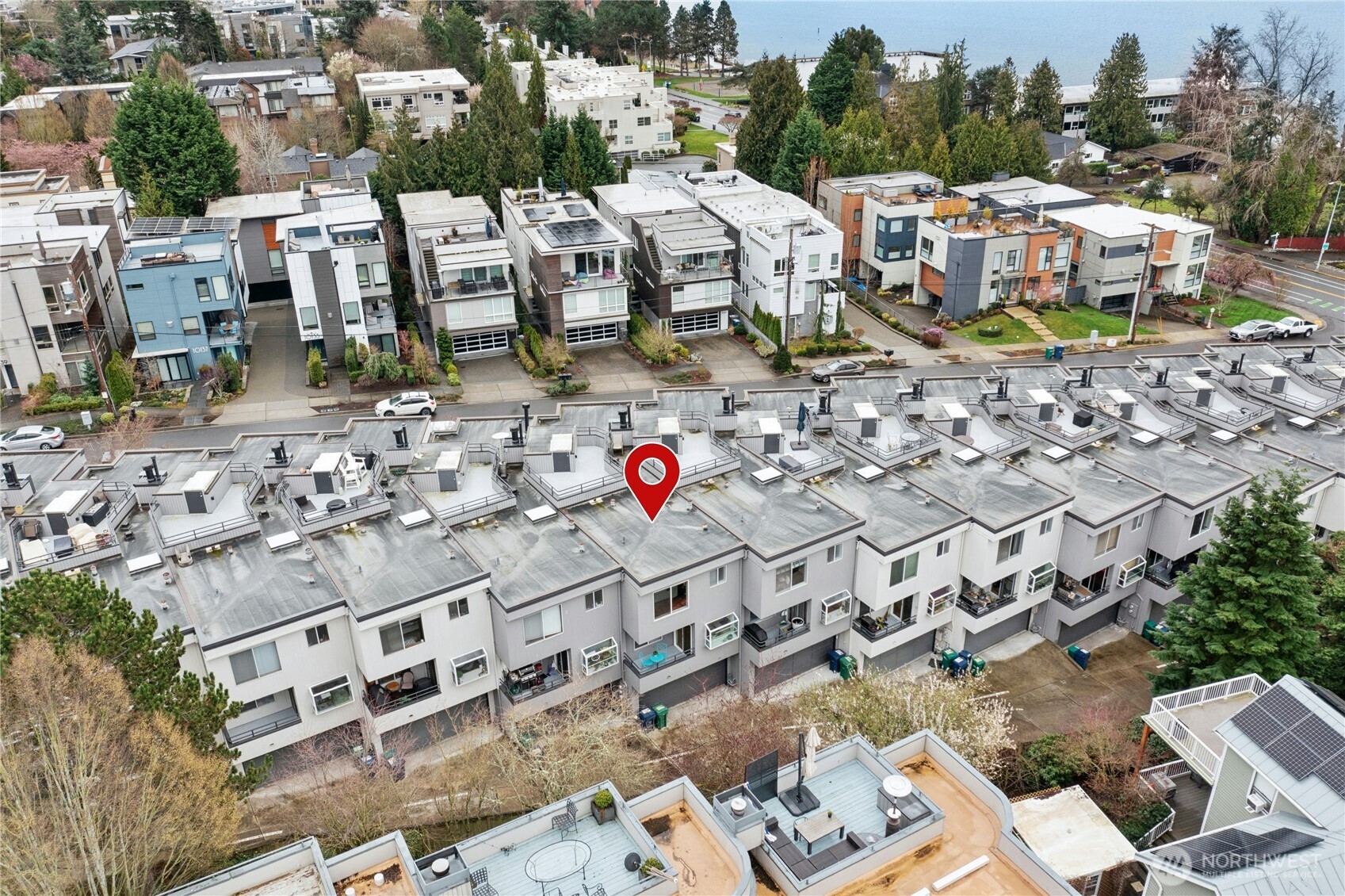 This shows the back of the townhome with the garage entrance. The 2-car attached garage has a new electric panel to support EV charging along with a nice storage area and tankless water heater for instant hot water.