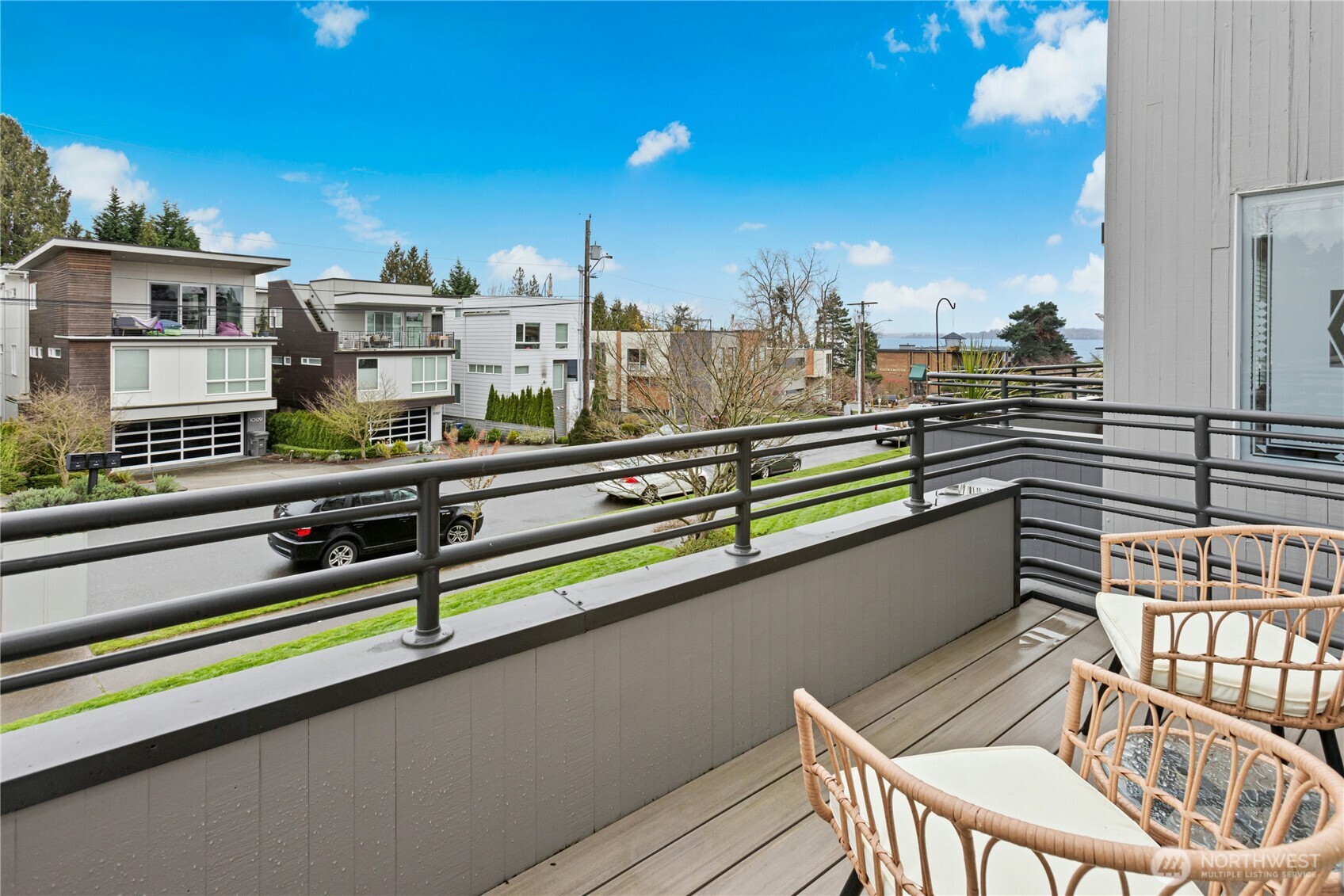 The balcony features composite decking and lake views.