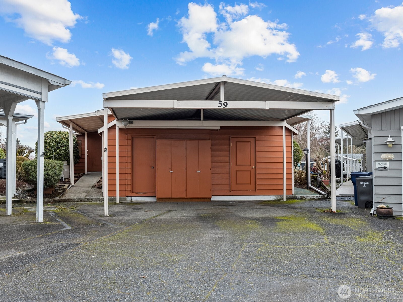 The carport is great for 2 cars and has even more storage space.